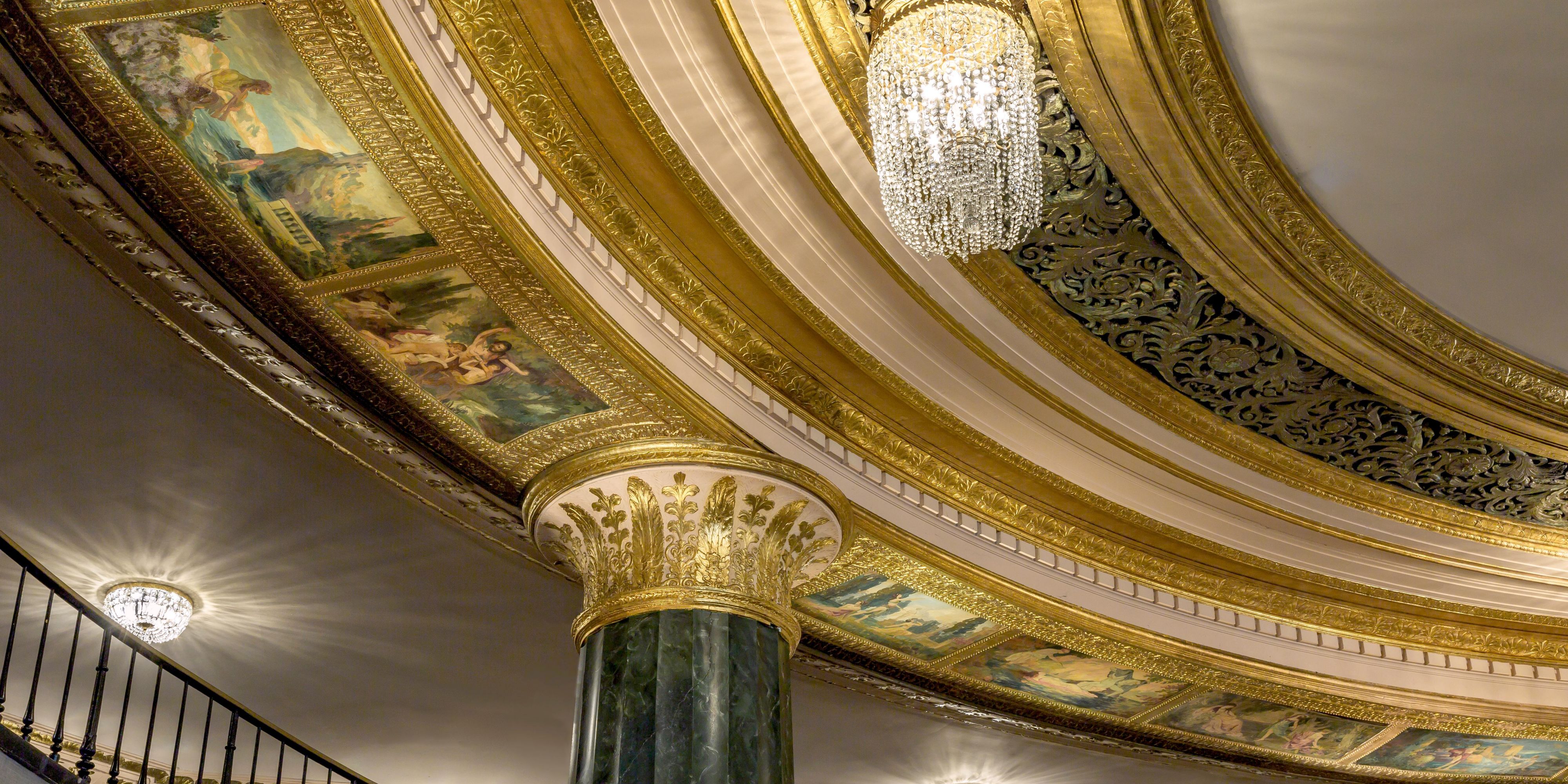 The building, home to InterContinental Chicago Magnificent Mile, was designed by legendary architect Walter W. Ahlschlager in 1929. Many of the building’s original architectural details remain: marble columns, bronze doorway, grand staircase, painted ceilings, cast-bronze friezes, and exotic Moorish-influenced gold dome.