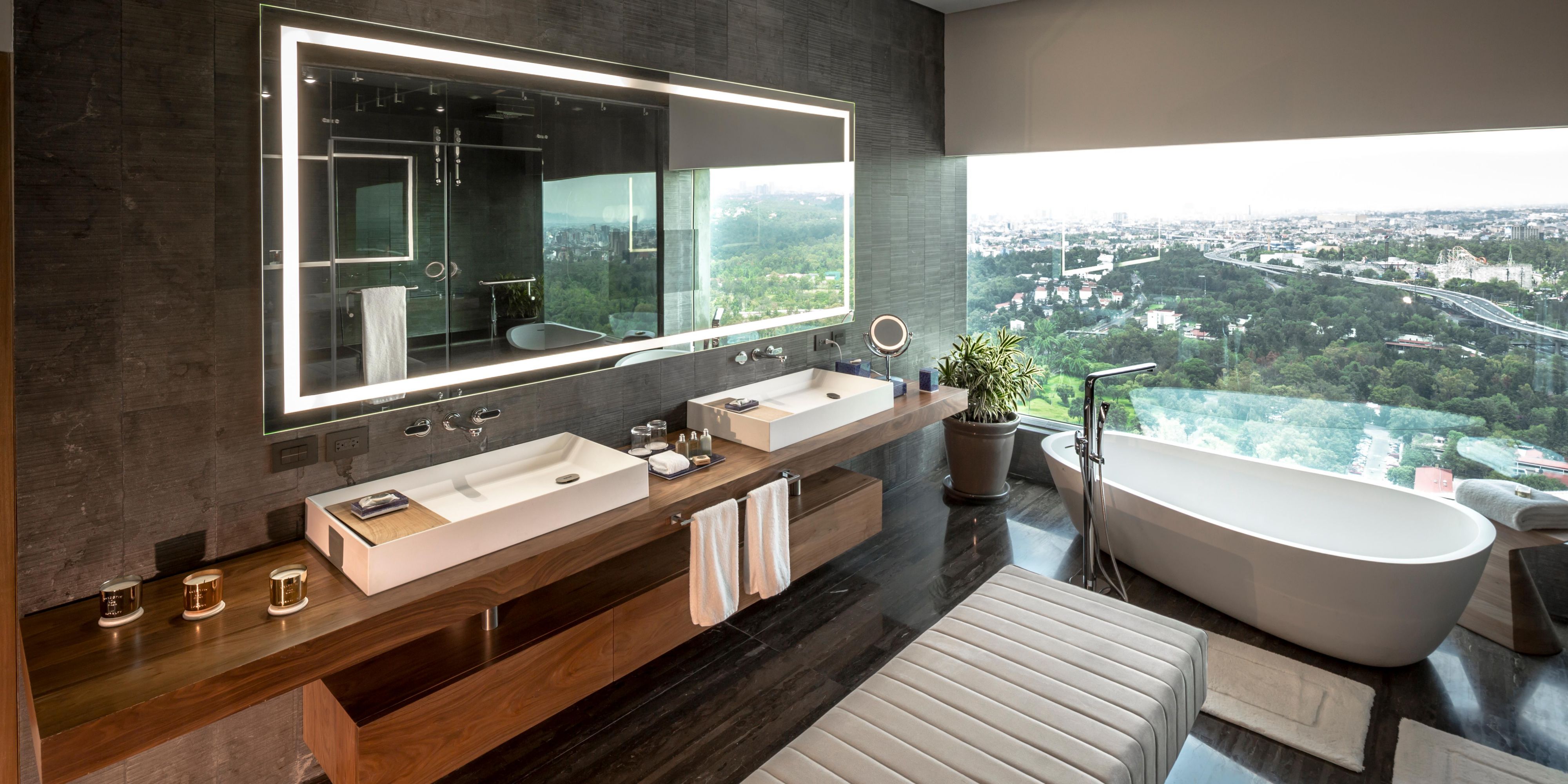 Unwind in our spacious bathrooms with a stunning view.