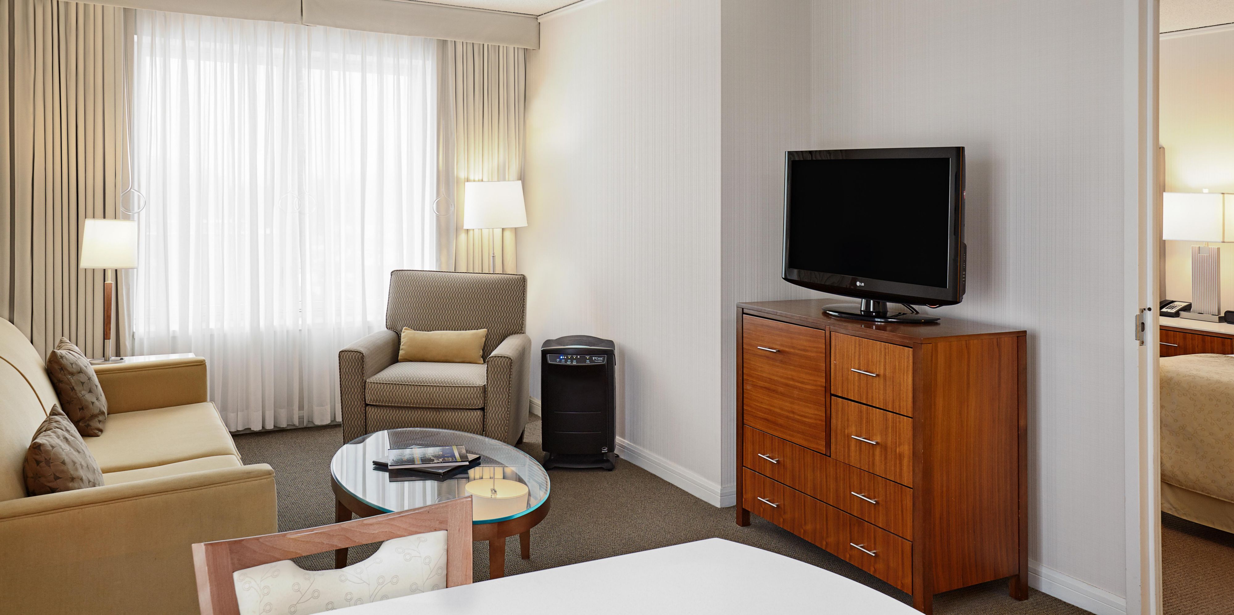 Suite with separate living area, sleeper sofa and dining table 