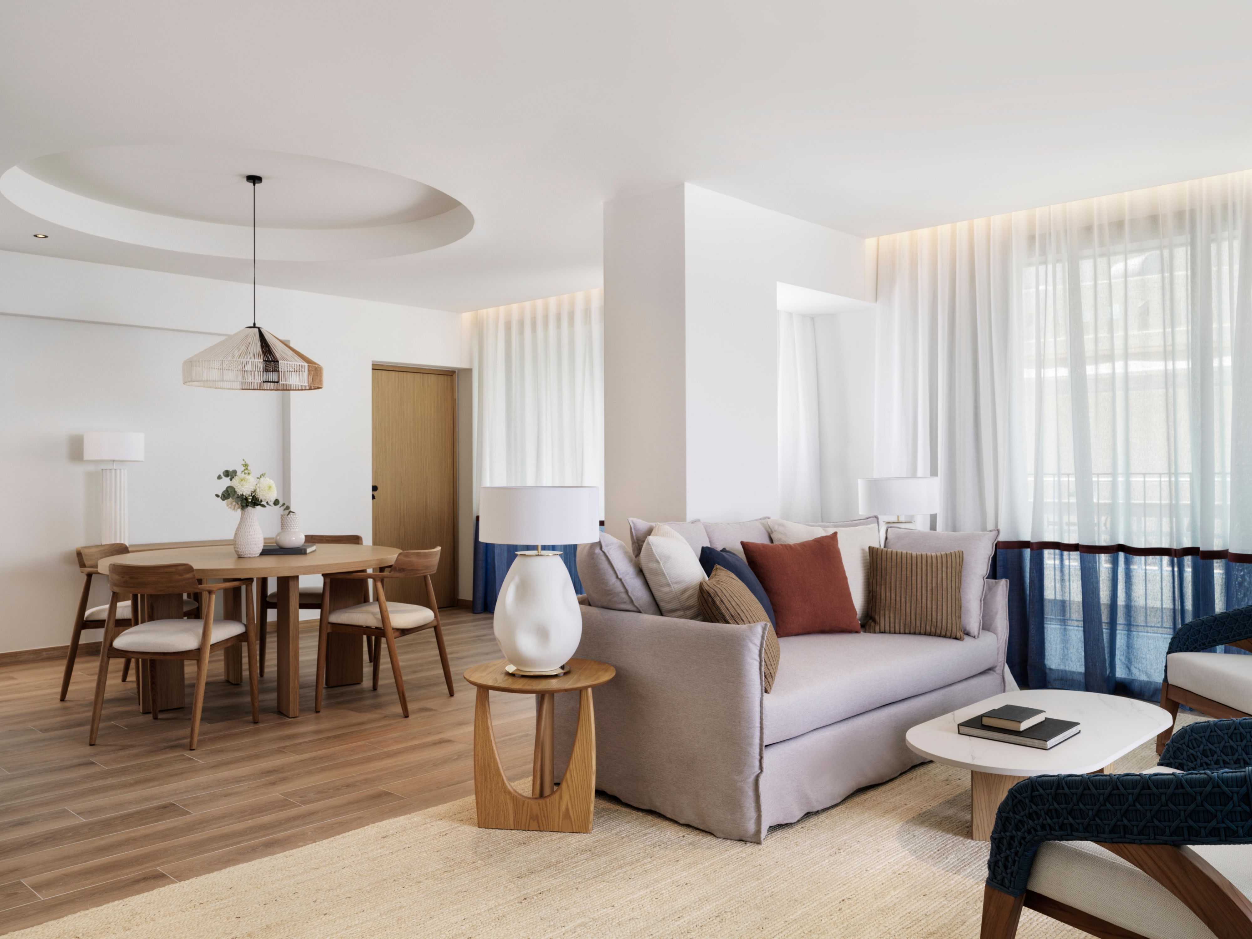 large suite living area with dining table and chairs