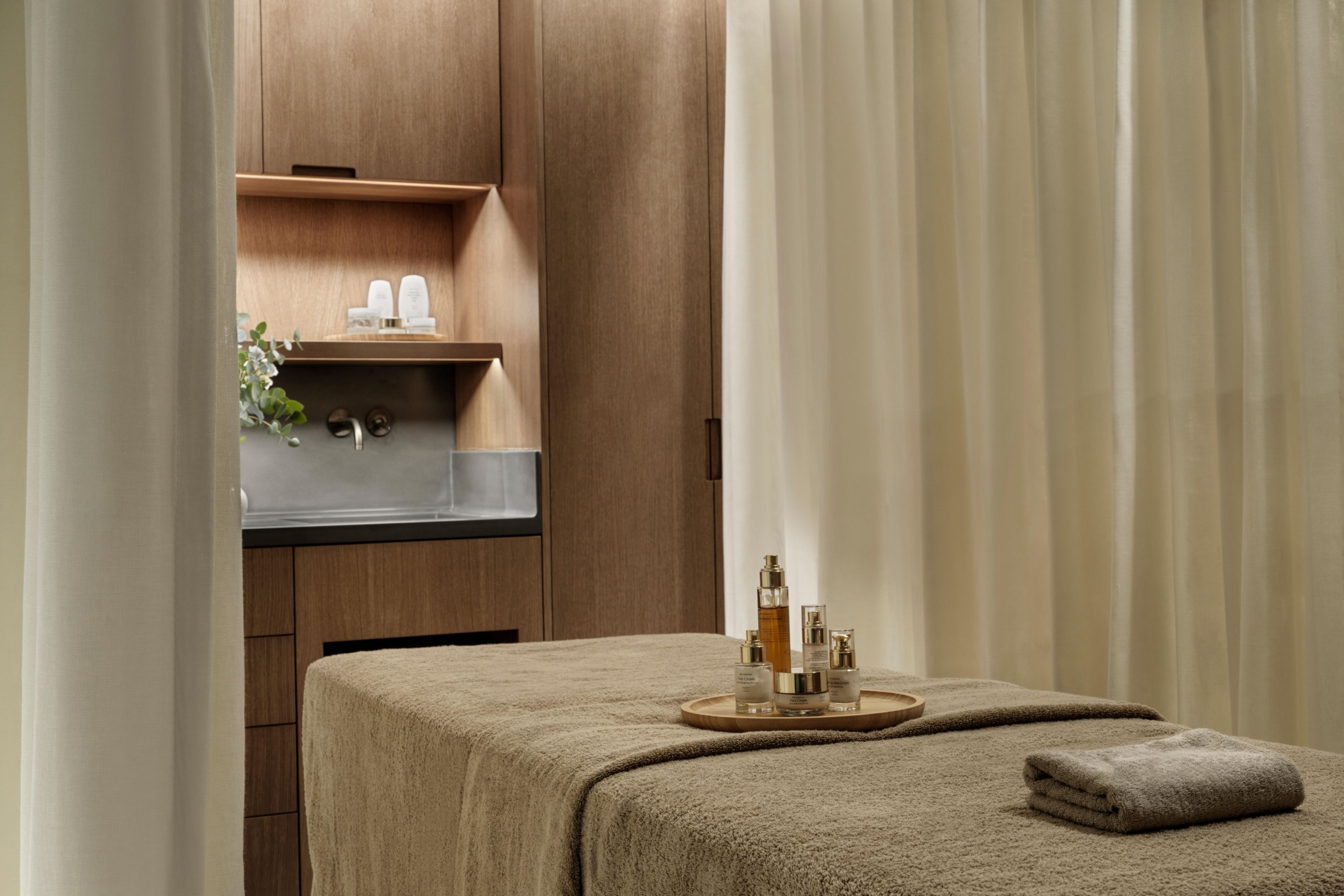 luxury spa treatment room with dim lighting and luxury products