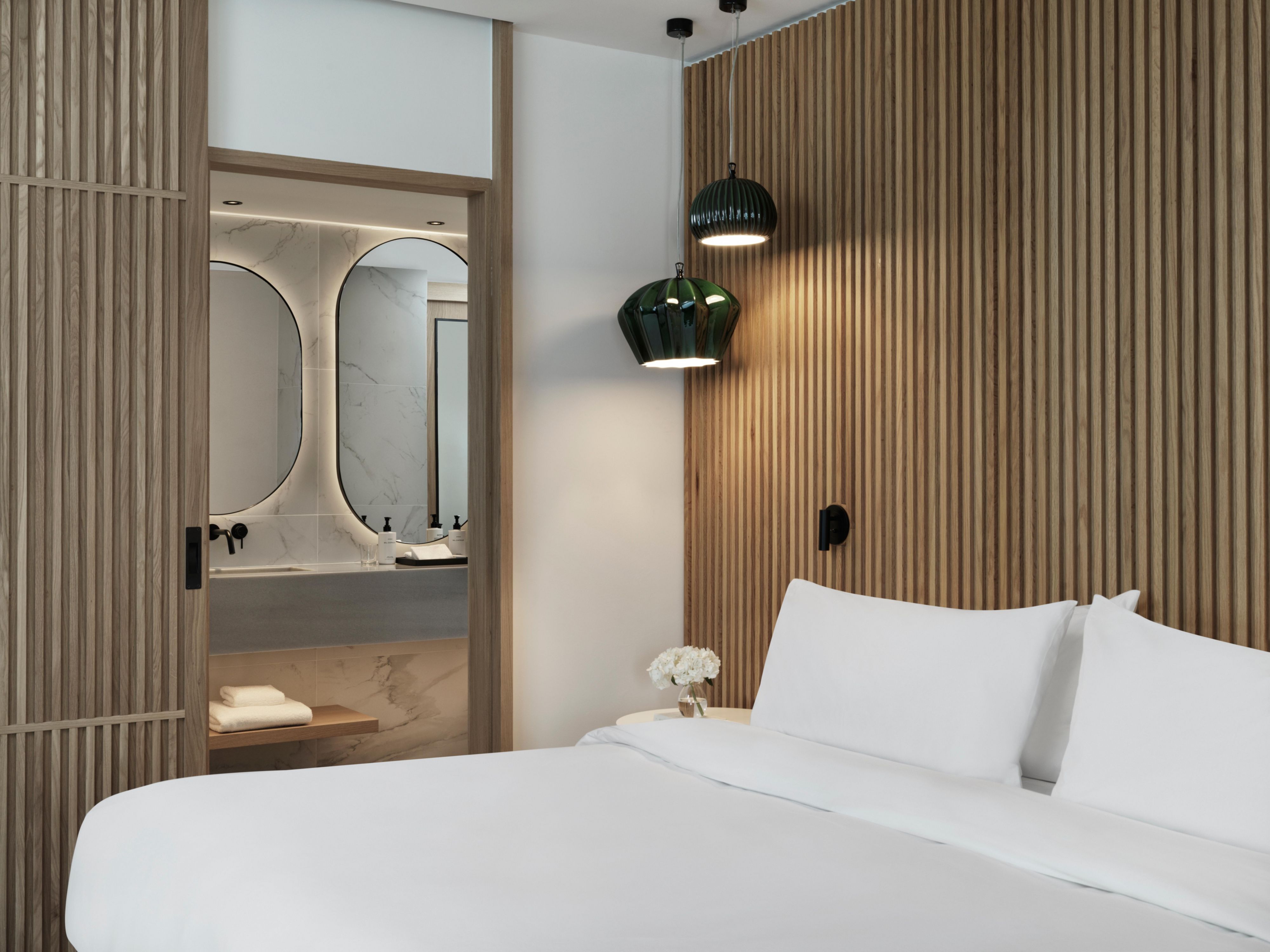luxury bedroom with wooden panelled walls