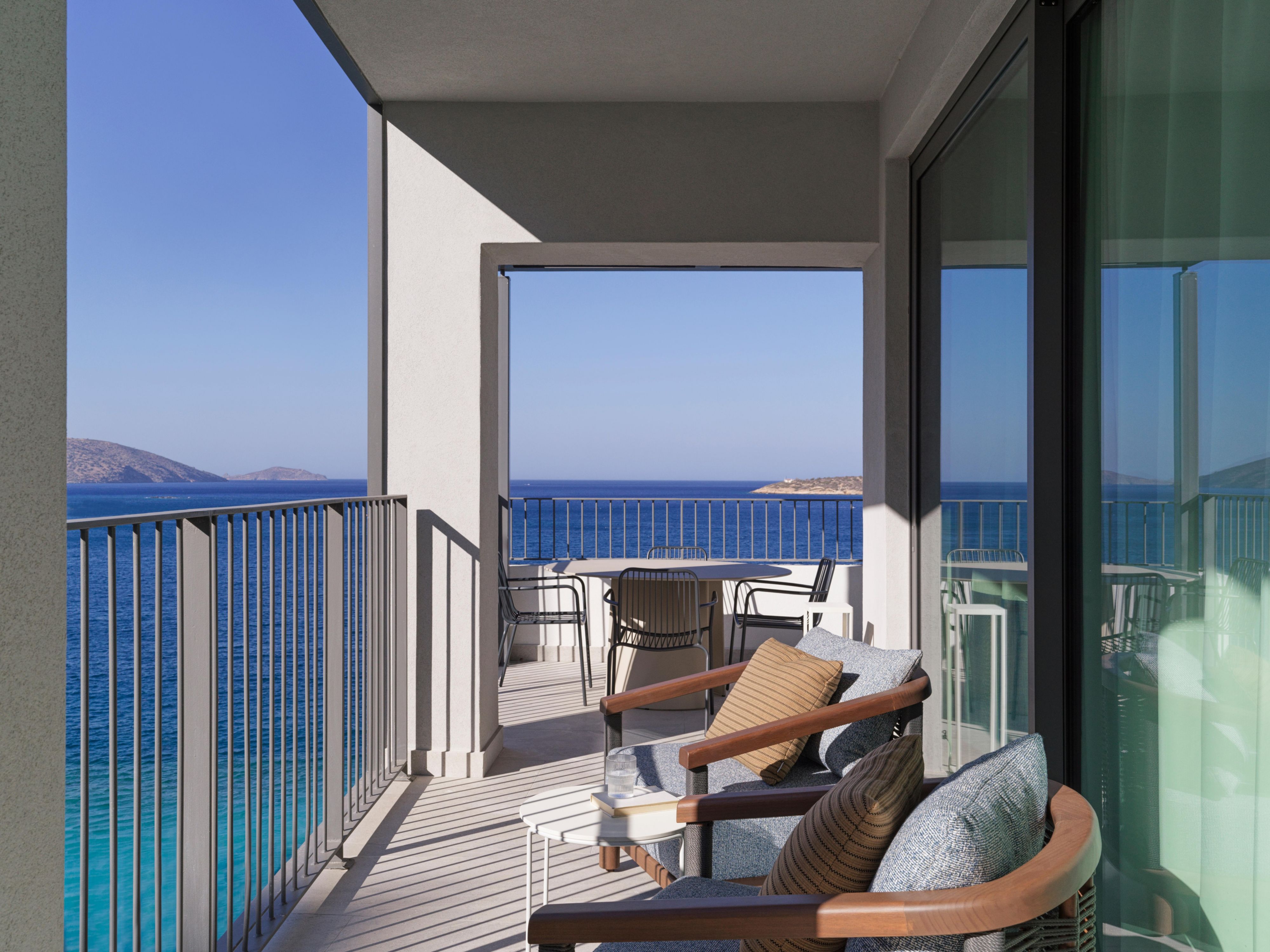 #corner balcony with bright blue ocean views