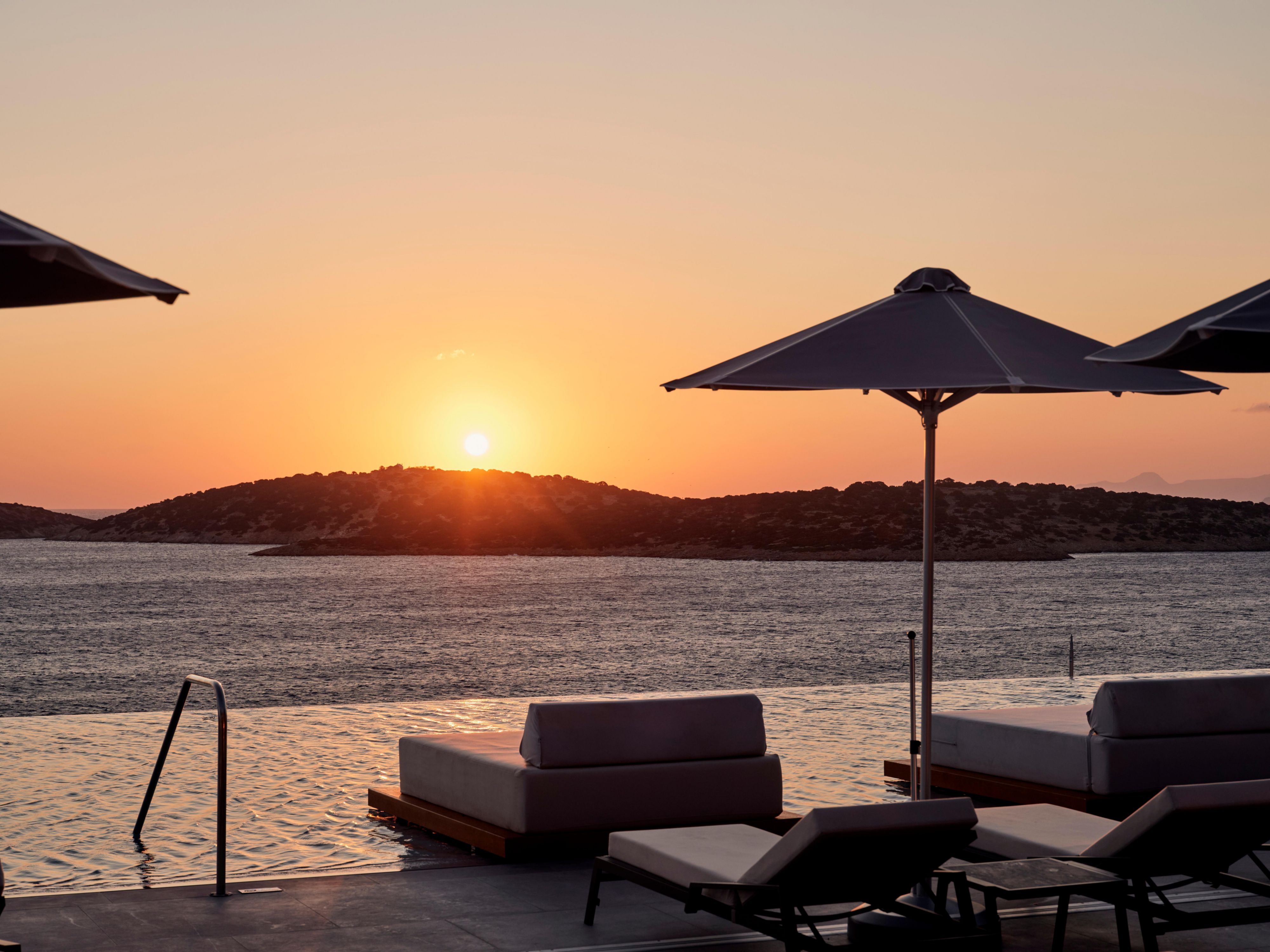 infinity pool and ocean views as the sun goes down