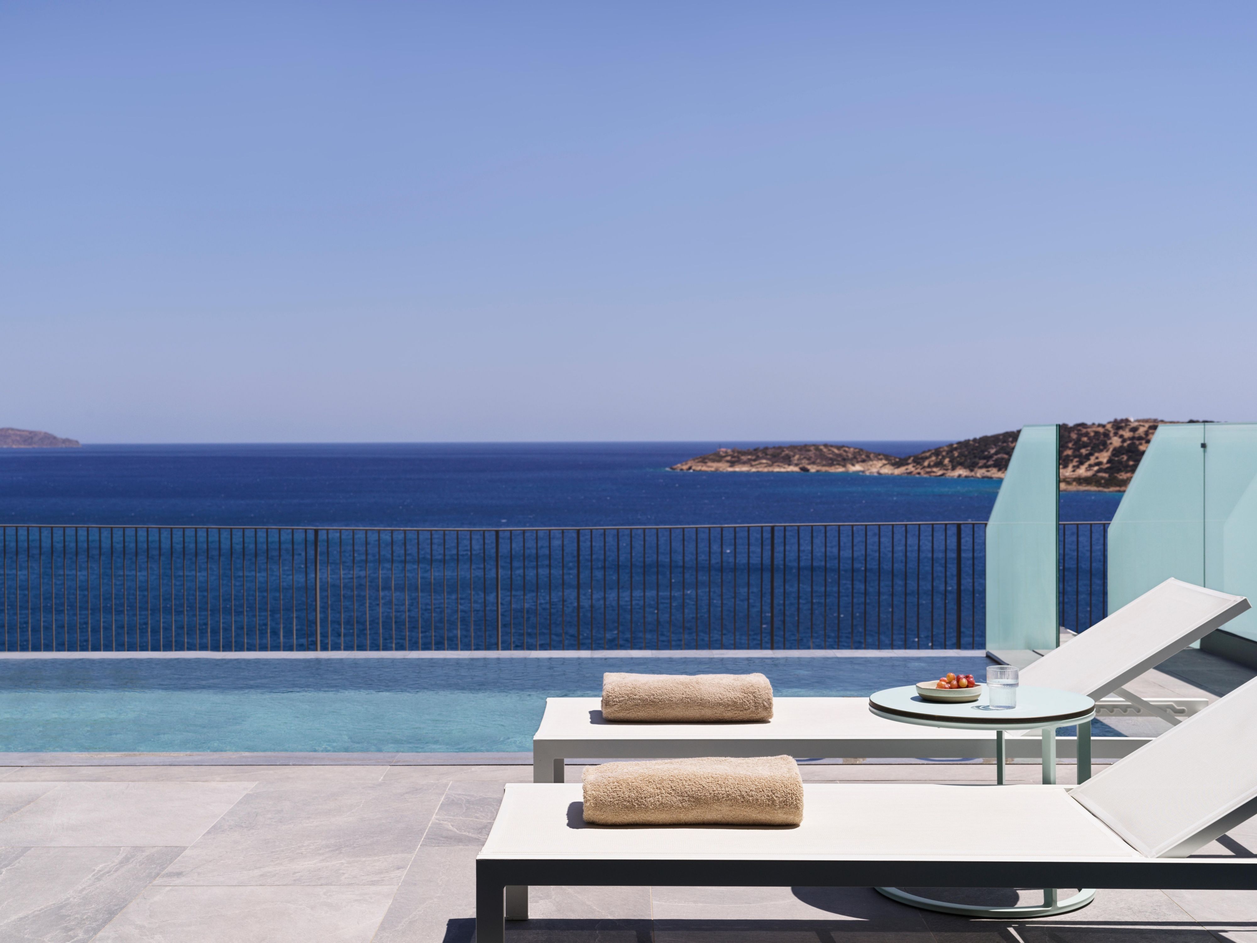 Sun loungers at the Panorama Blue Suite Swimming Pool 