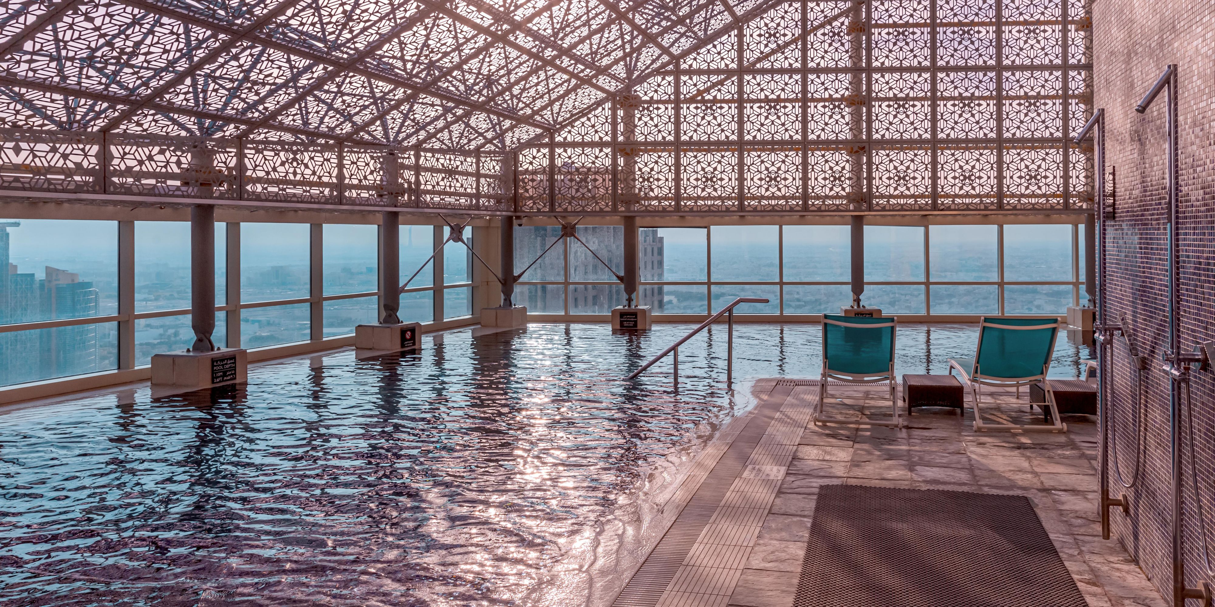 High above the bustling streets, the 46th-floor open pool provides a serene escape with breathtaking views of Doha's skyline—a sanctuary of relaxation amid the city's energetic pace.
