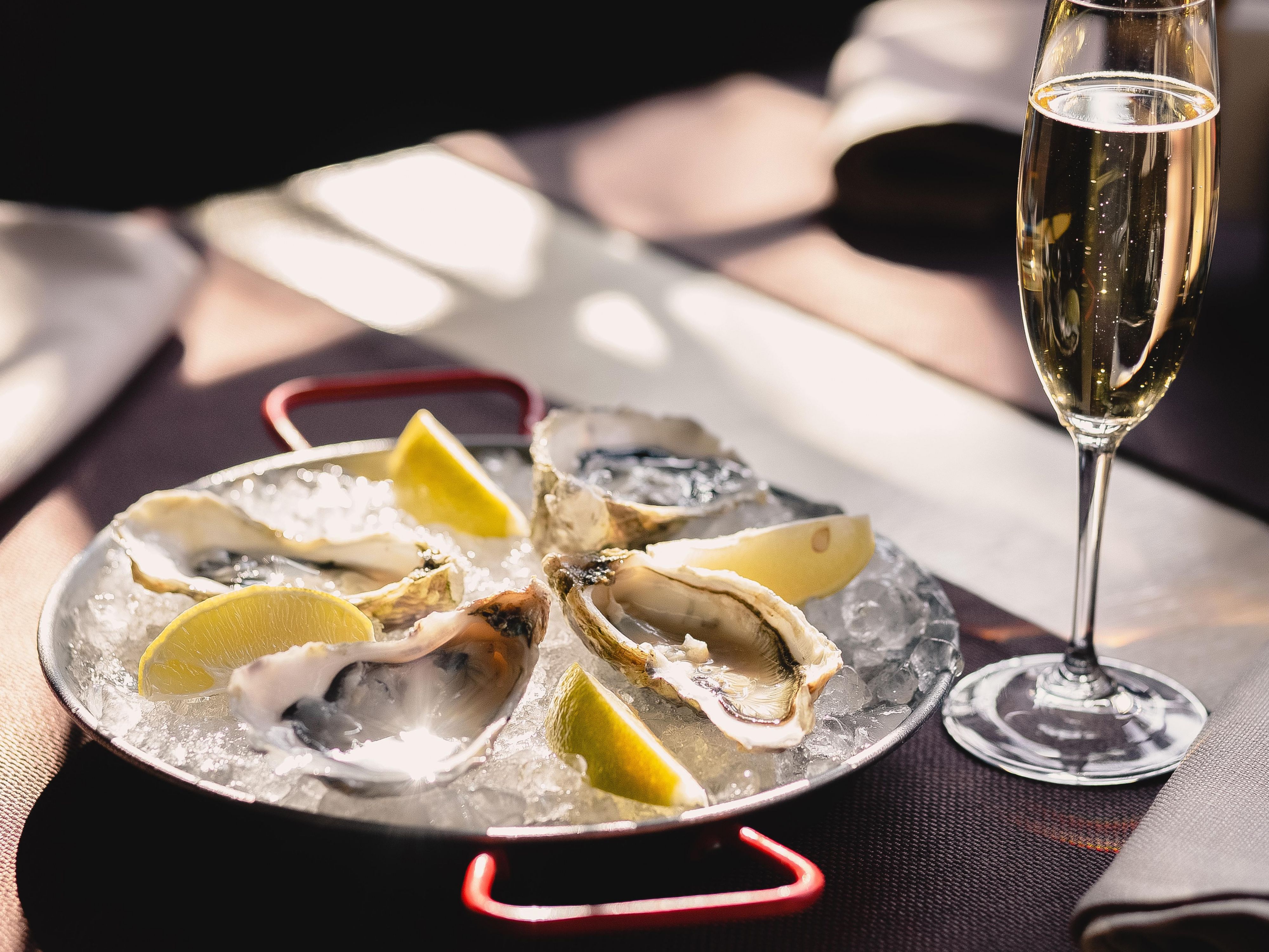 Oysters on ice with a glass of champagne