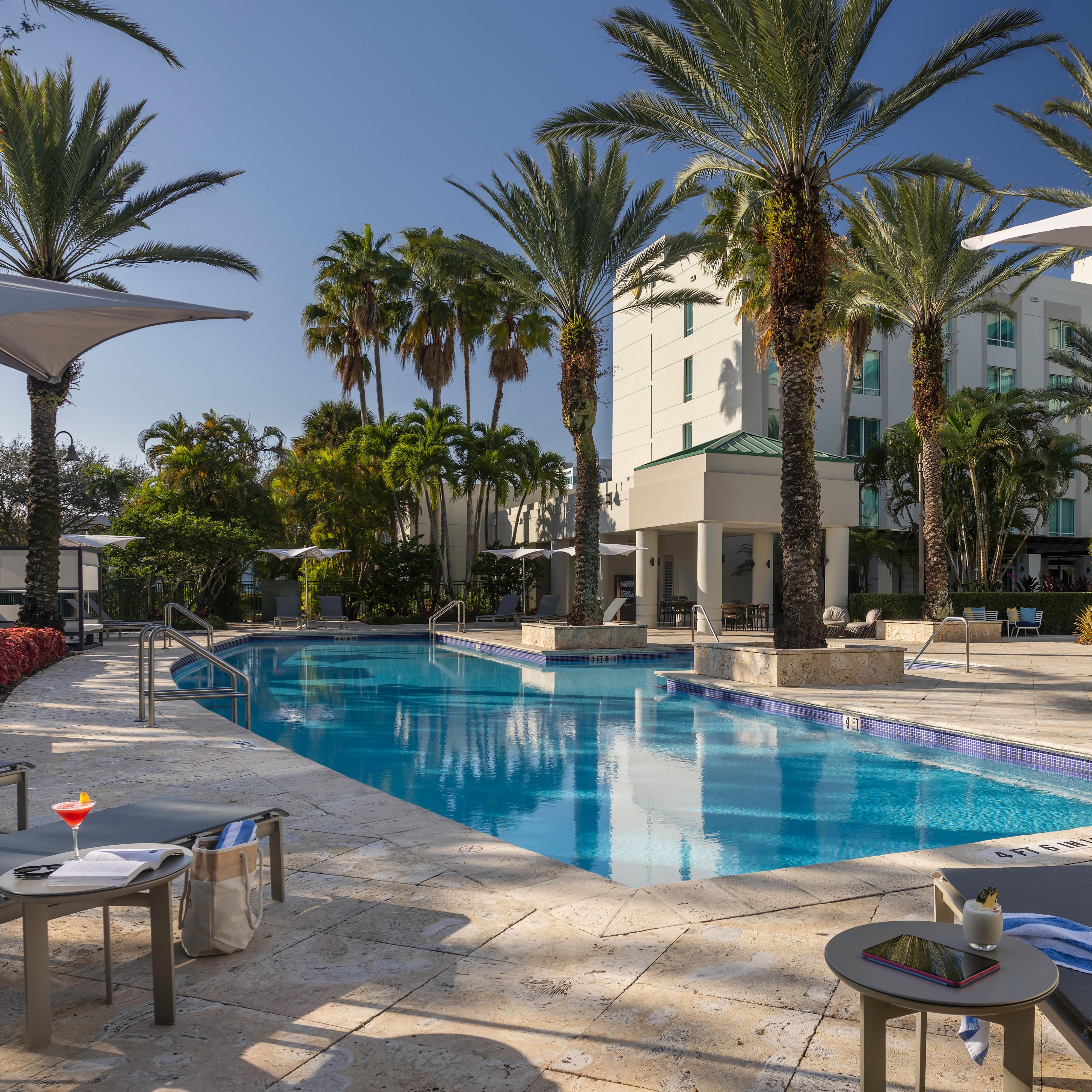 Palm-fringed poolside retreat at InterContinental Doral Miami.