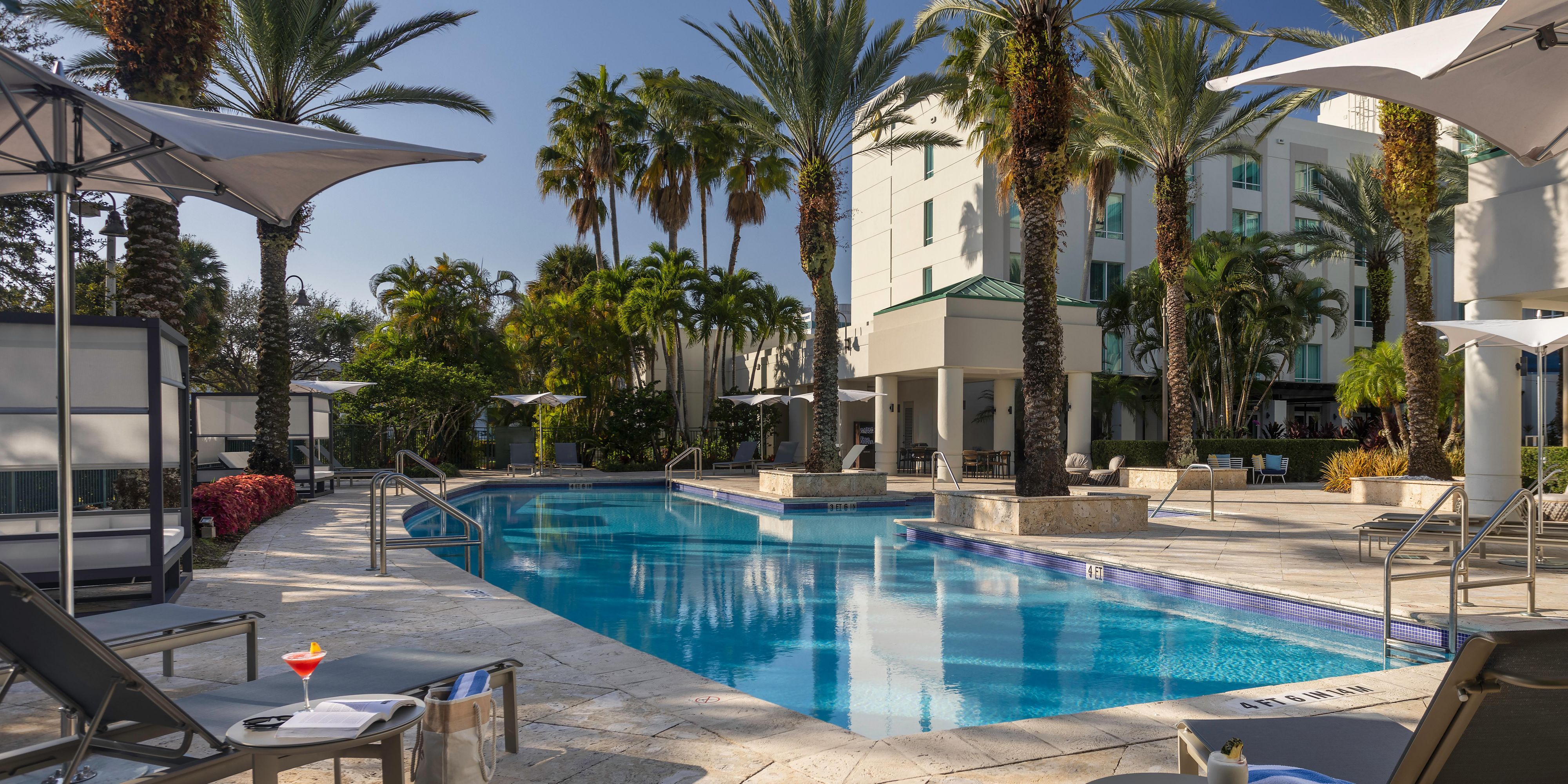 Palm-fringed poolside retreat at InterContinental Doral Miami.