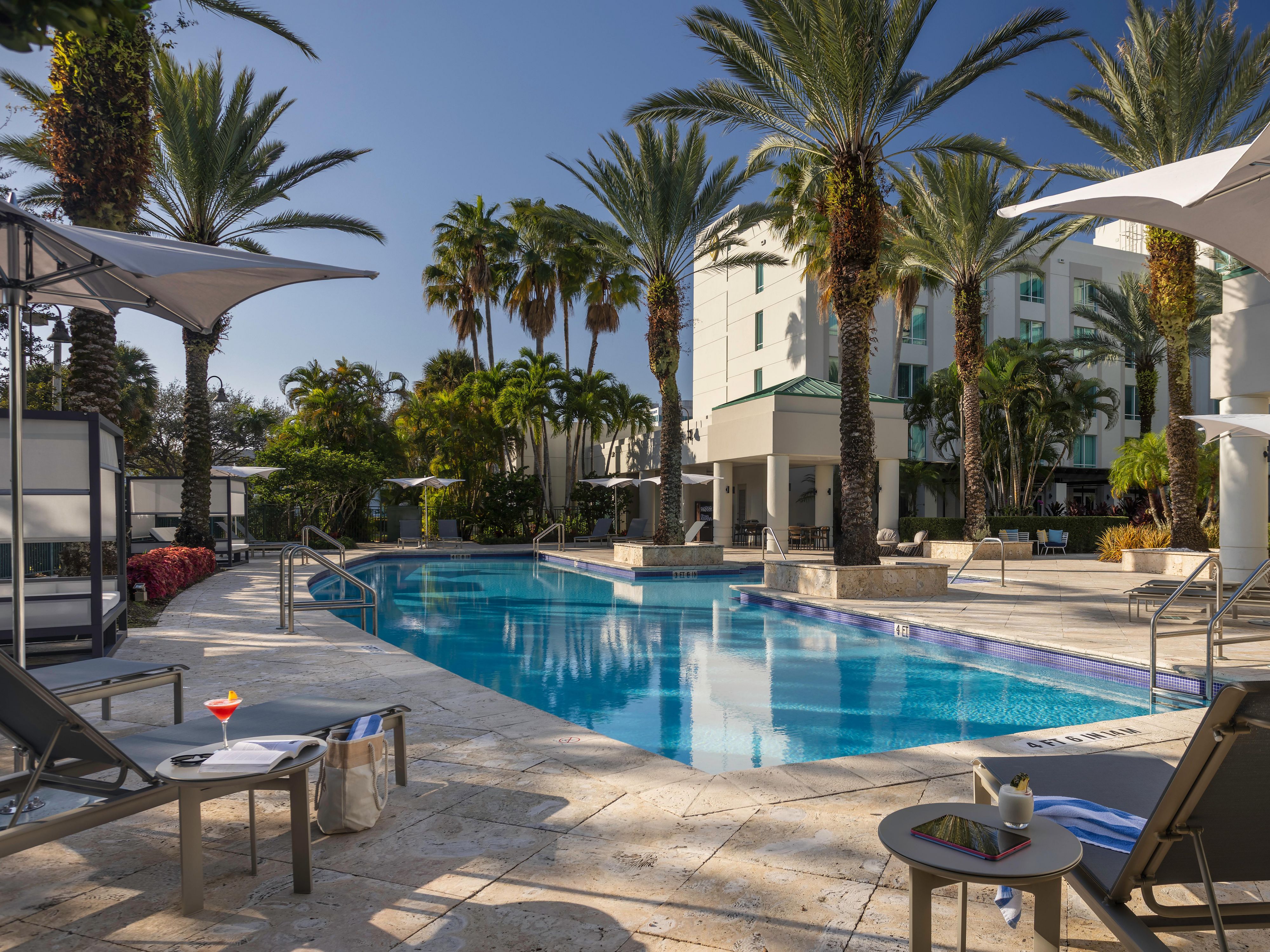 Palm-fringed poolside retreat at InterContinental Doral Miami.