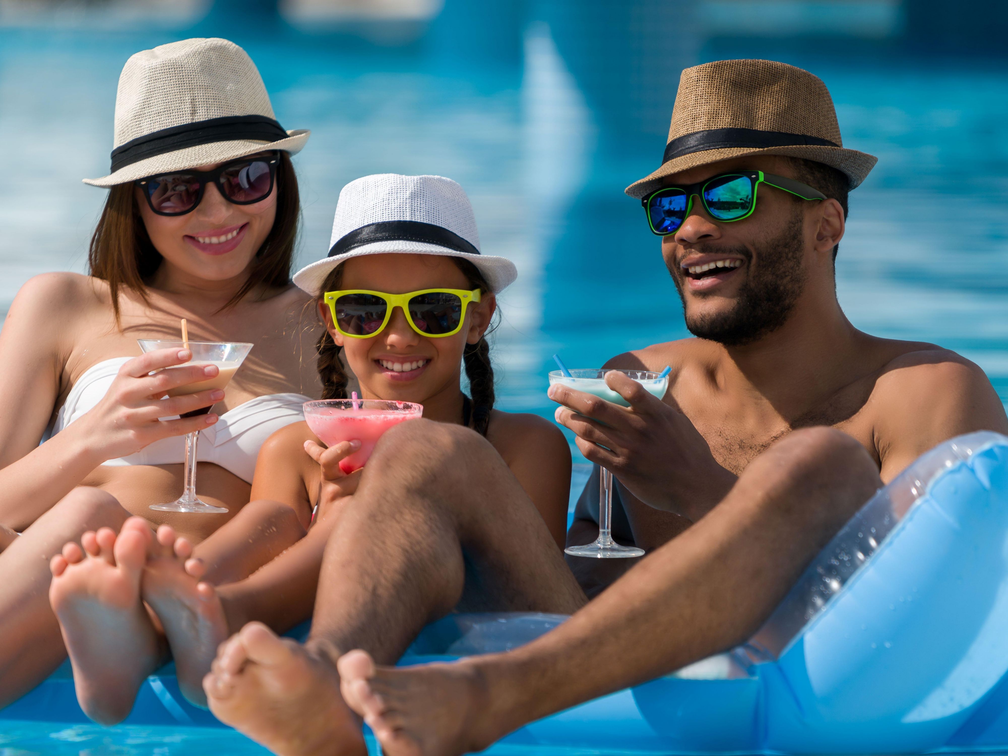 Enjoying a day in the pool as a family.
