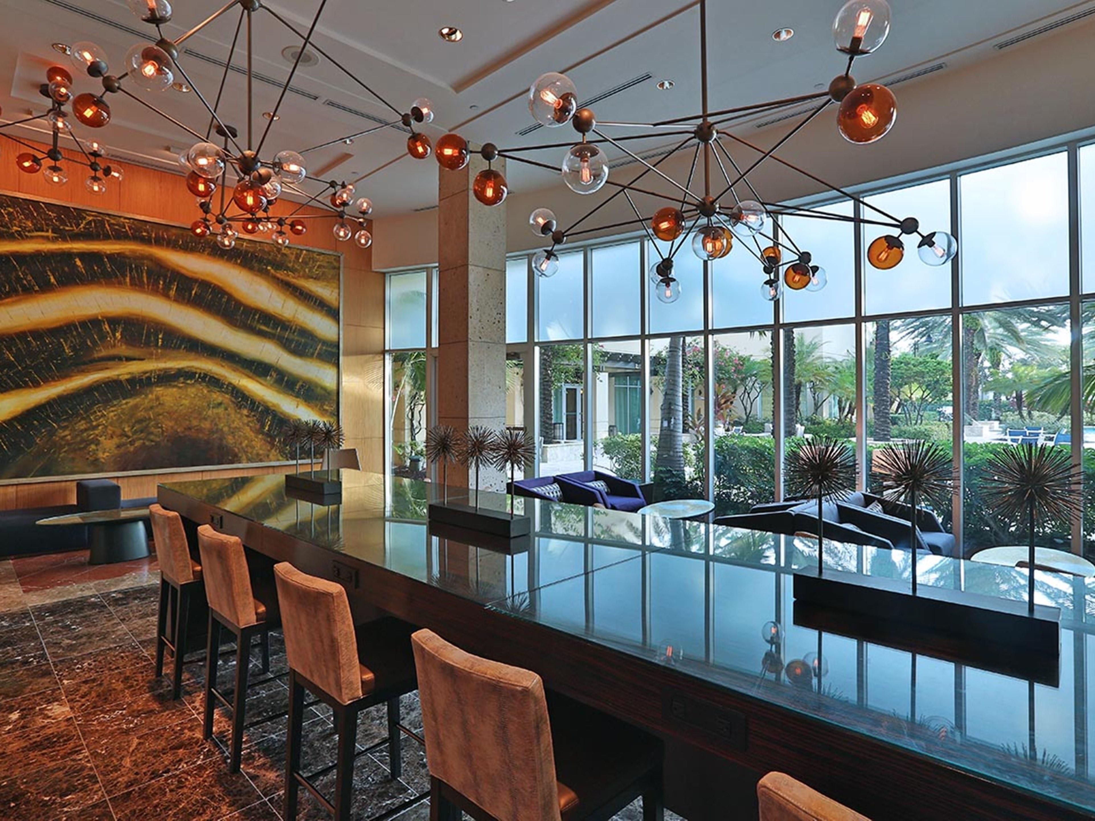 Enjoy plenty of seating and workspace in our spacious lobby.