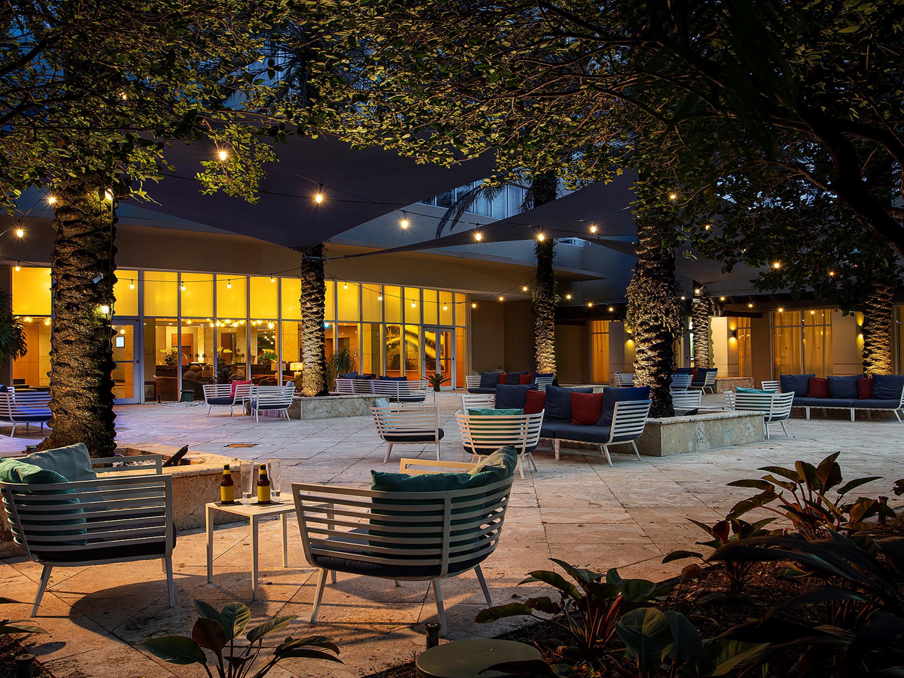 Outdoor courtyard with string lights at InterContinental at Doral.