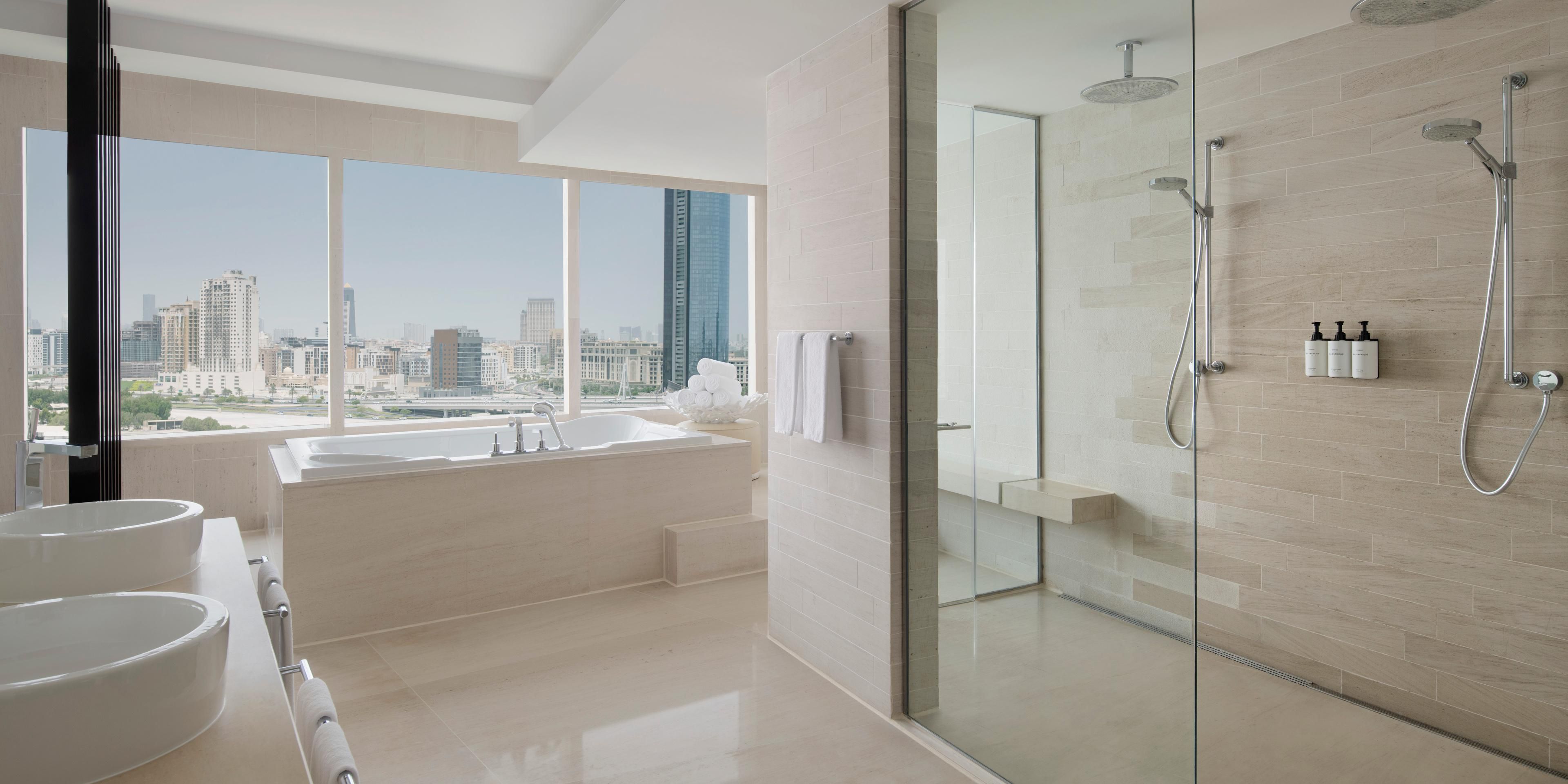 Relax in elegance with a bathroom boasting Dubai Skyline view