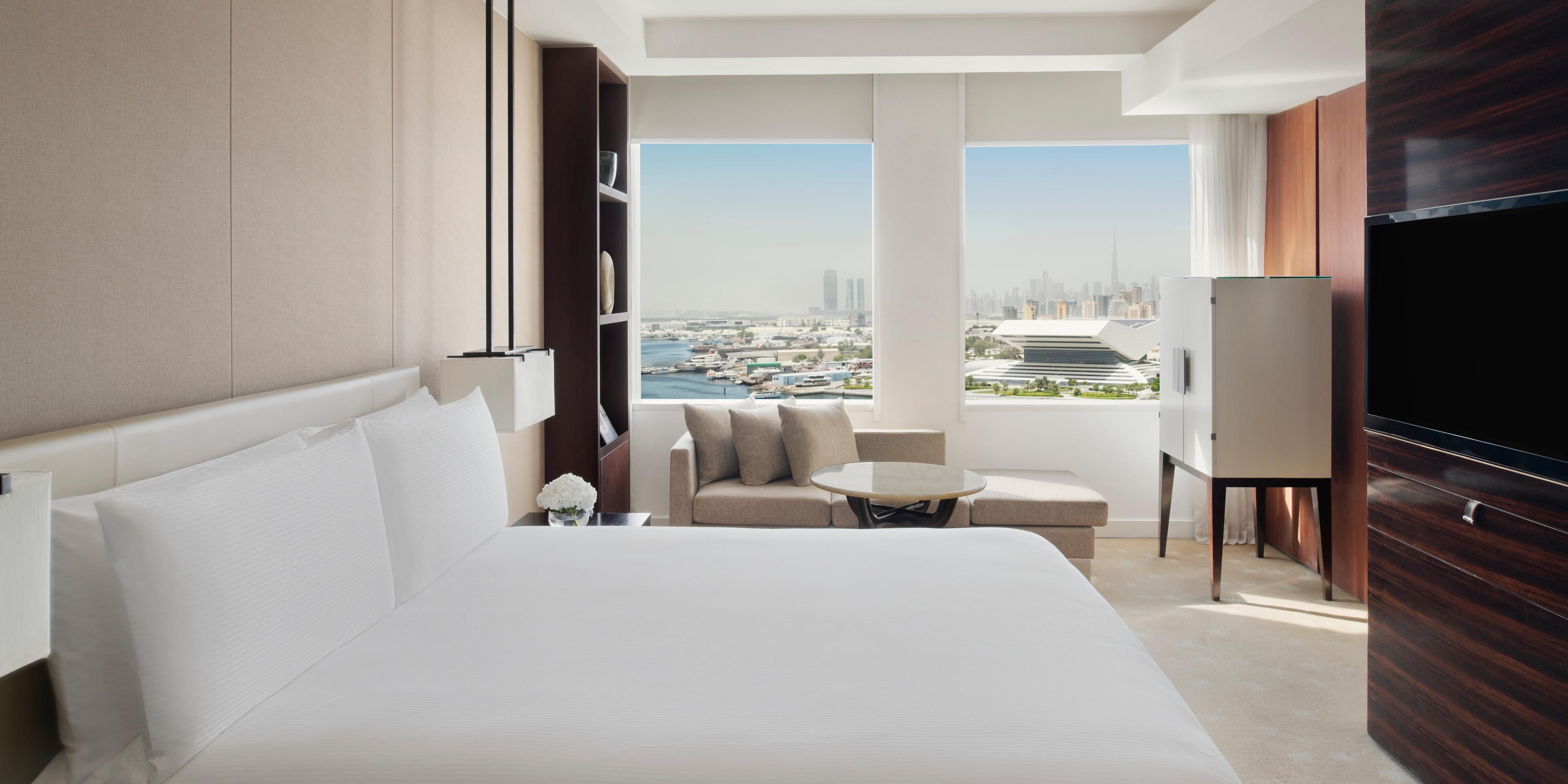 Elegant guest room with panorama of Dubai Skyline