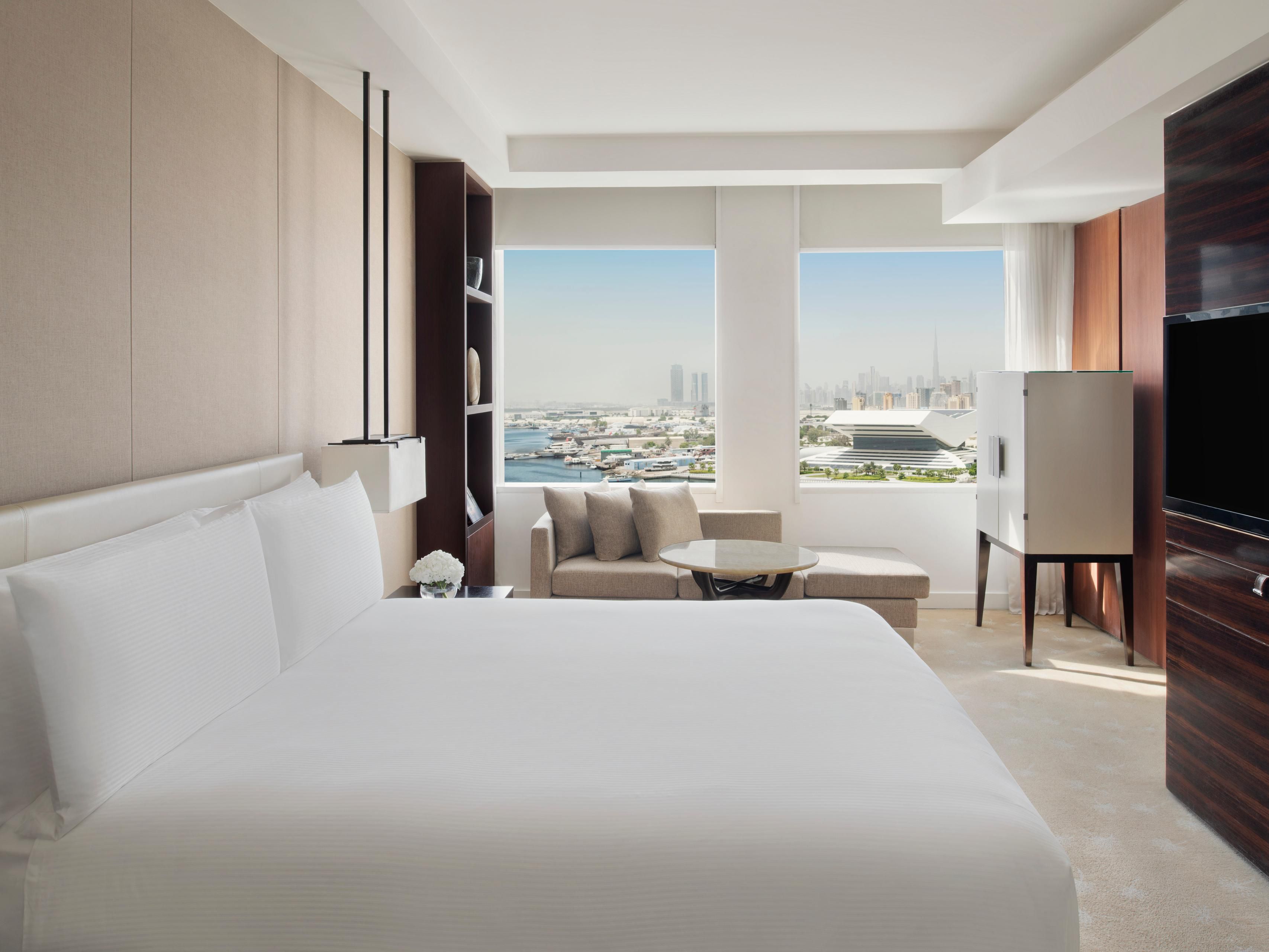 Elegant guest room with panorama of Dubai Skyline