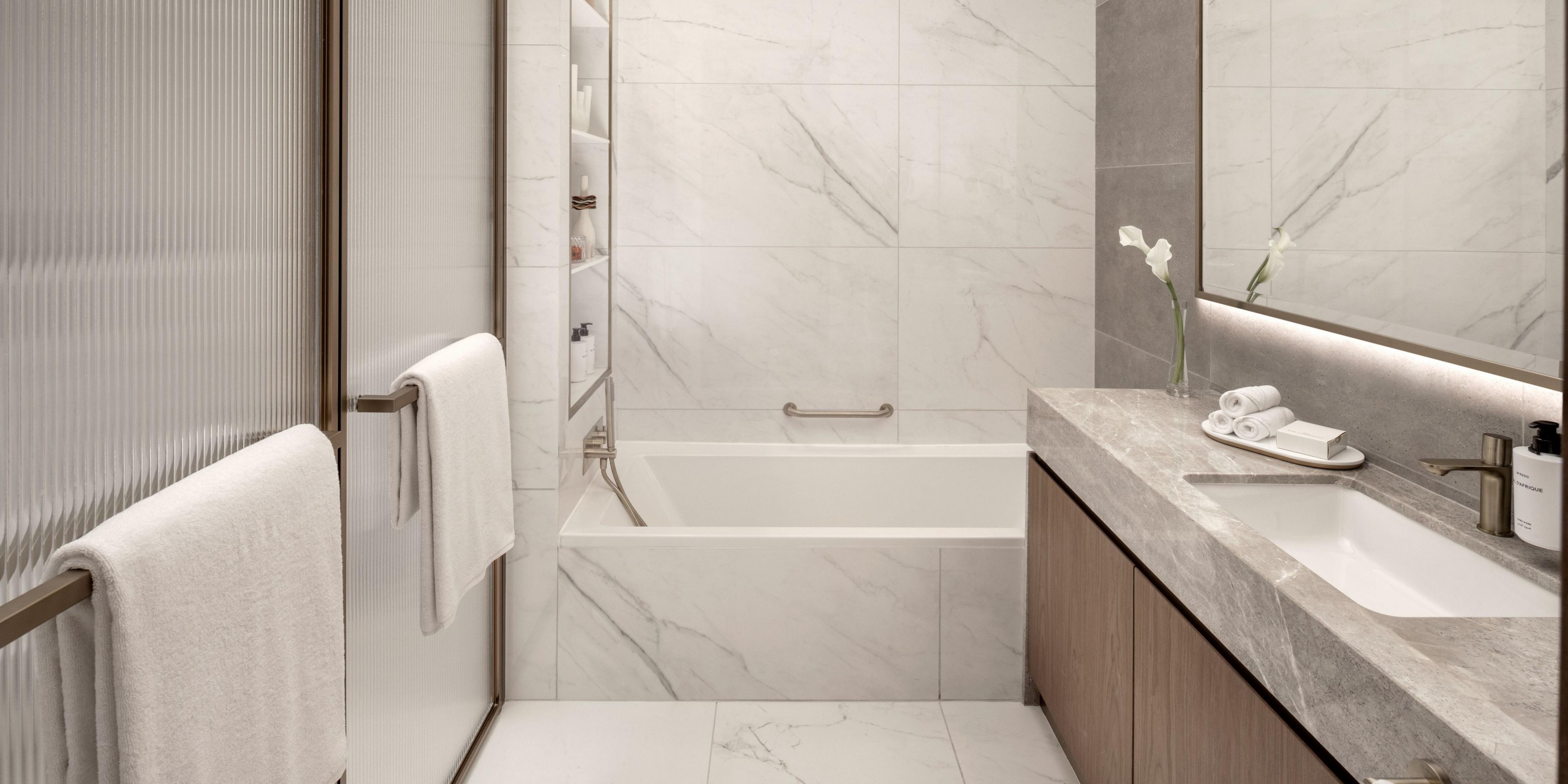 Spacious bathroom with walk in shower and bathtub