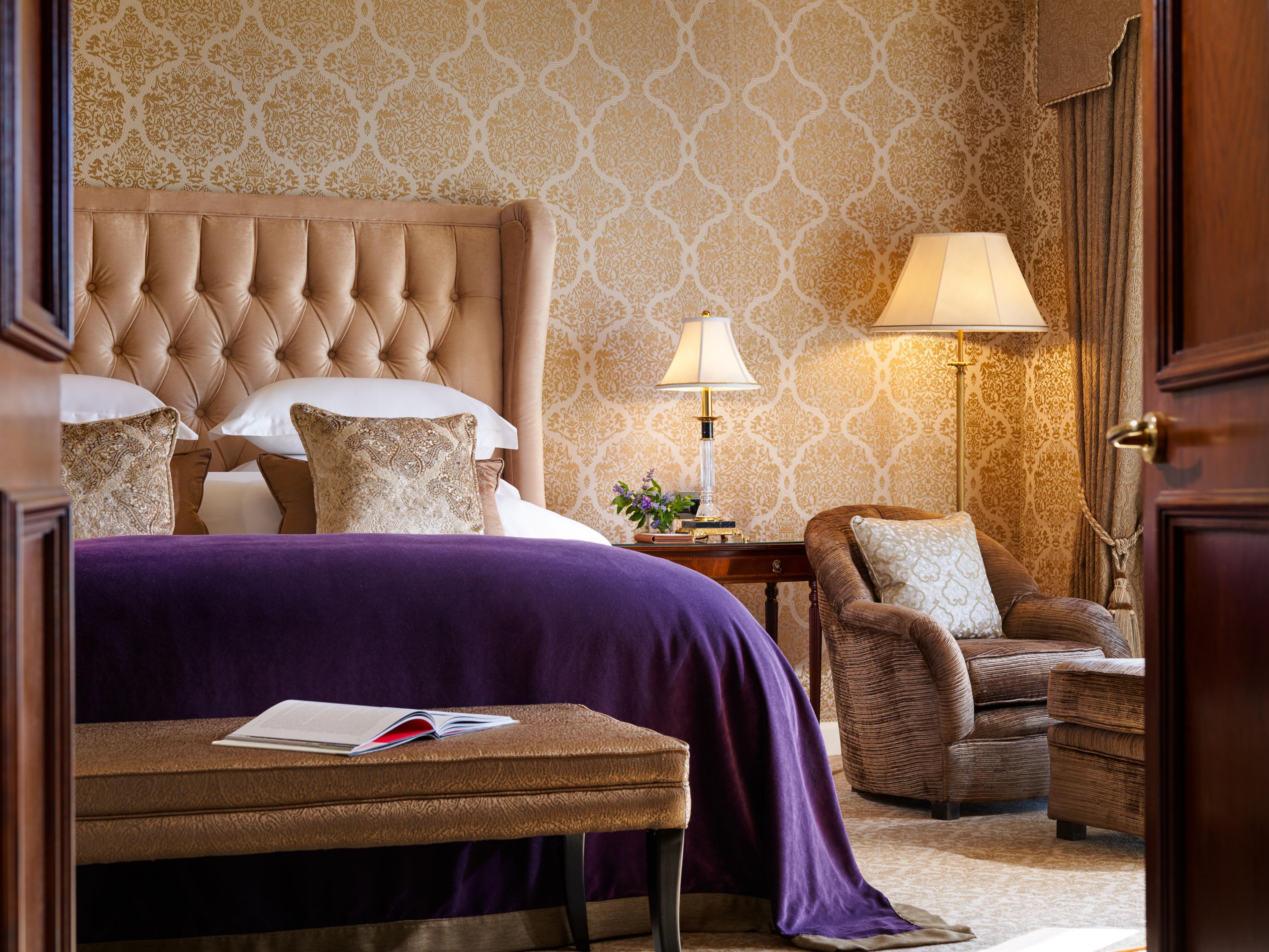 james joyce suite with large king sized  bed and cosy armchair ti look out the window