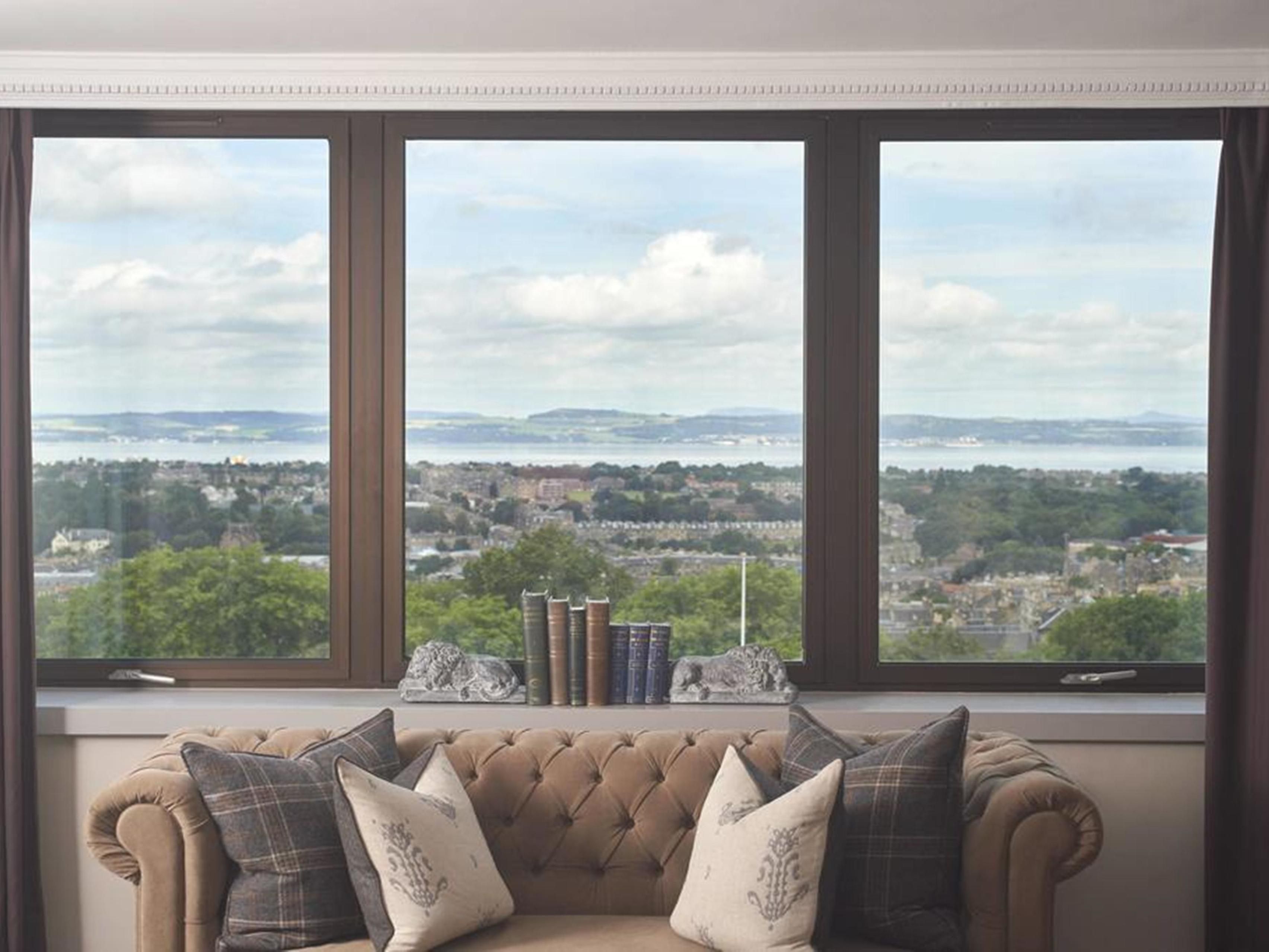 Hotel room with windows overlooking Edinburgh