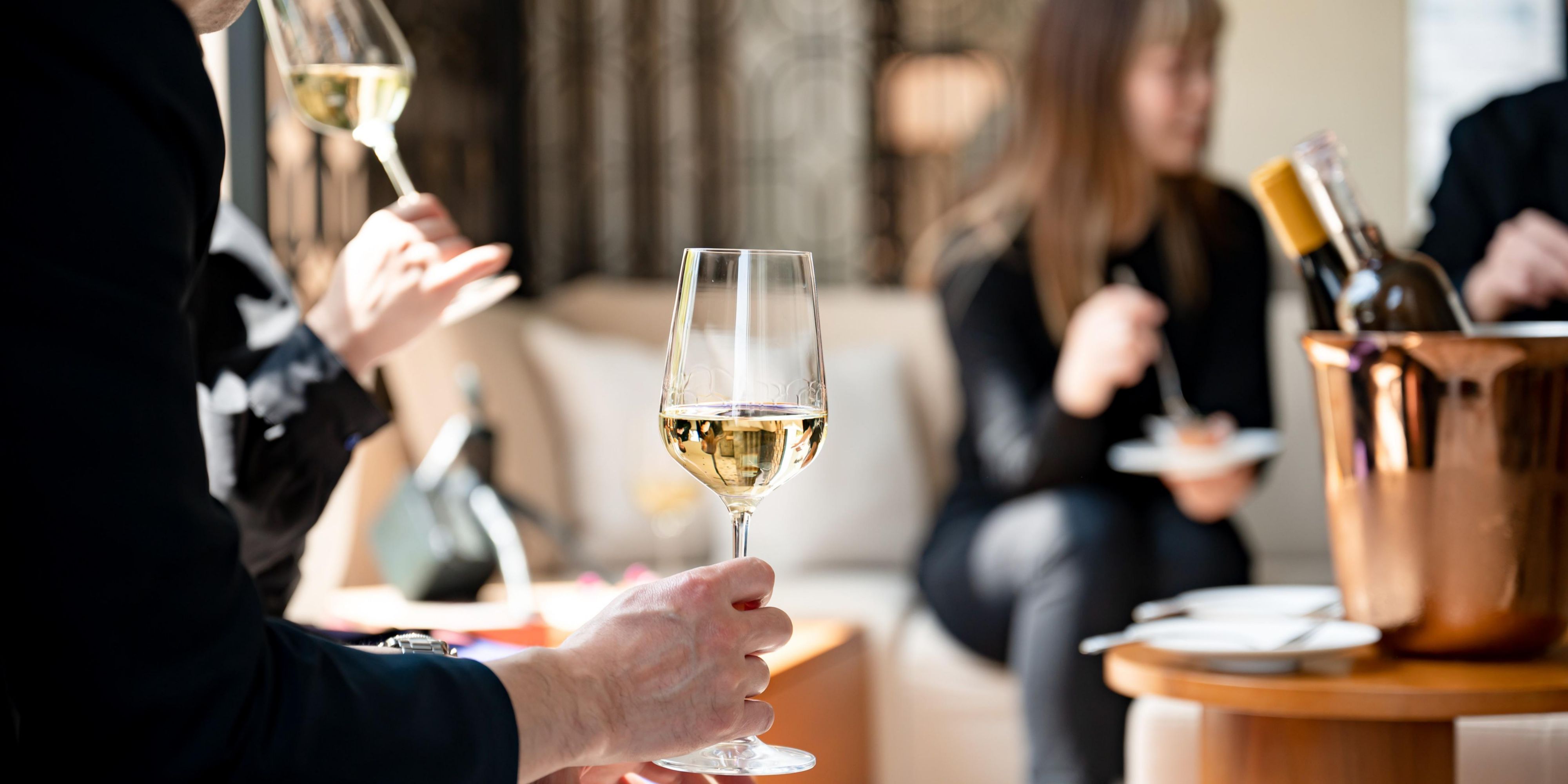 Guests sharing glasses of wine