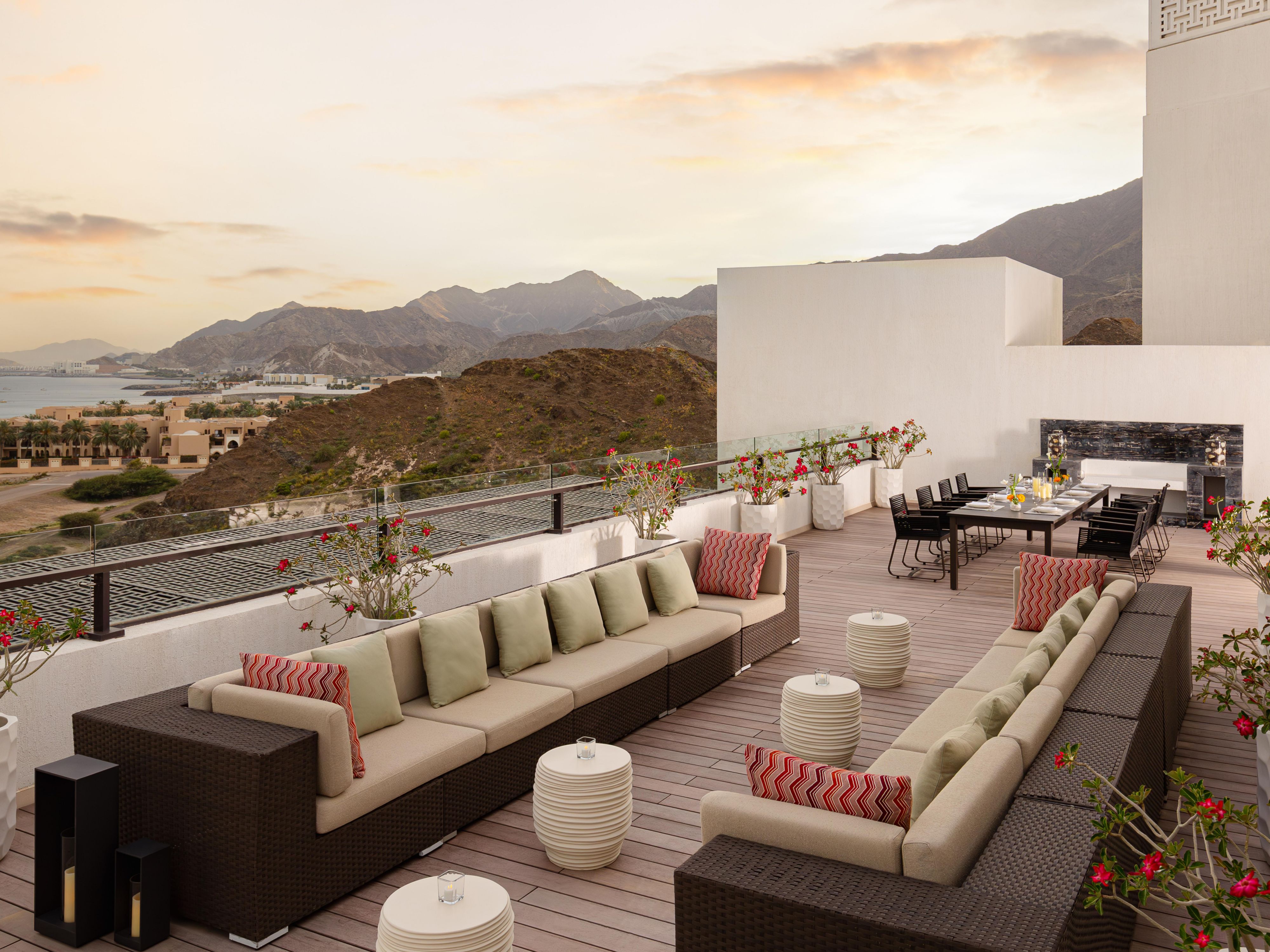 Rooftop lounge with mountain sunset views