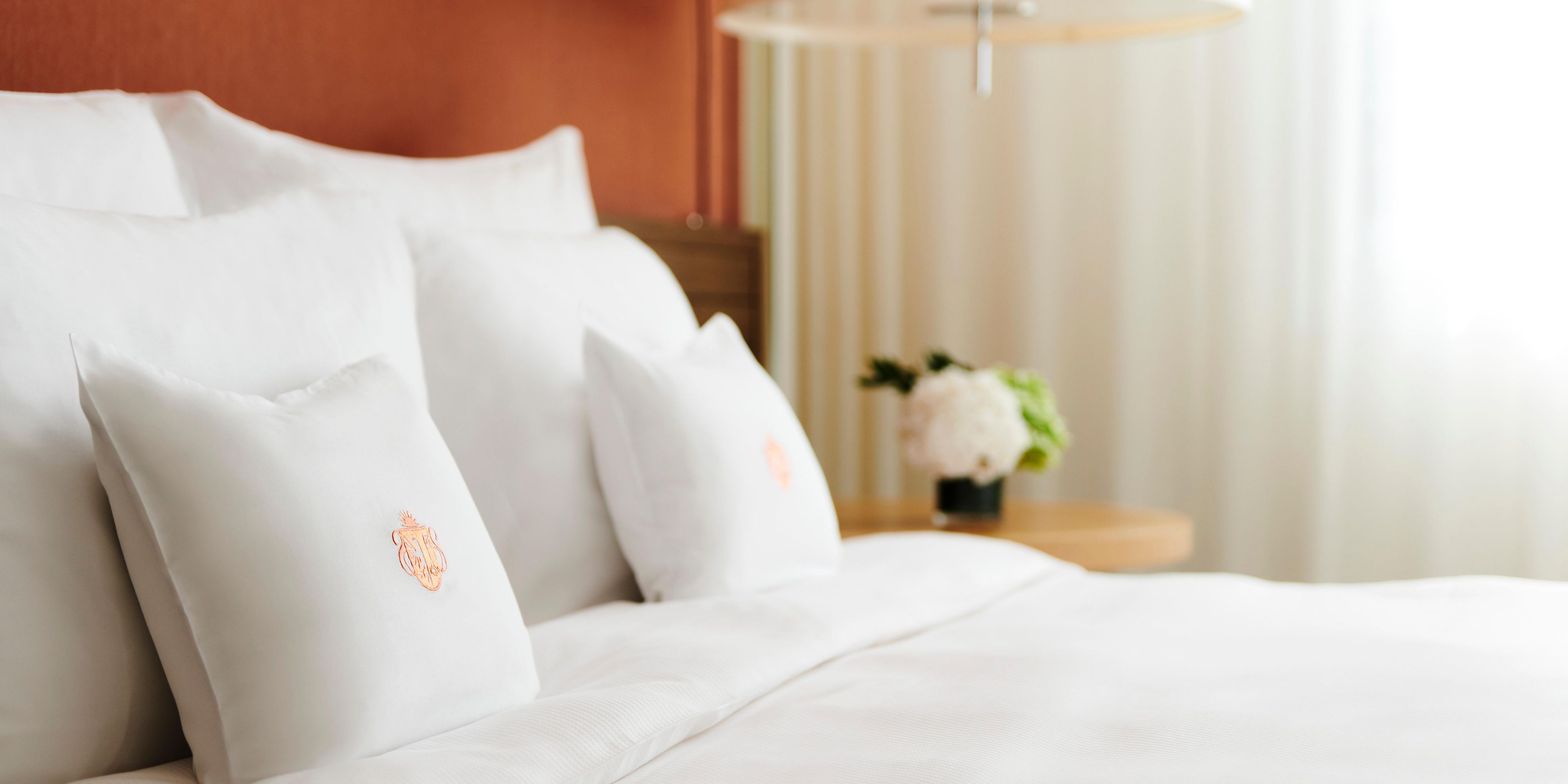 Sleep soundly between crisp sheets and on the plush pillows