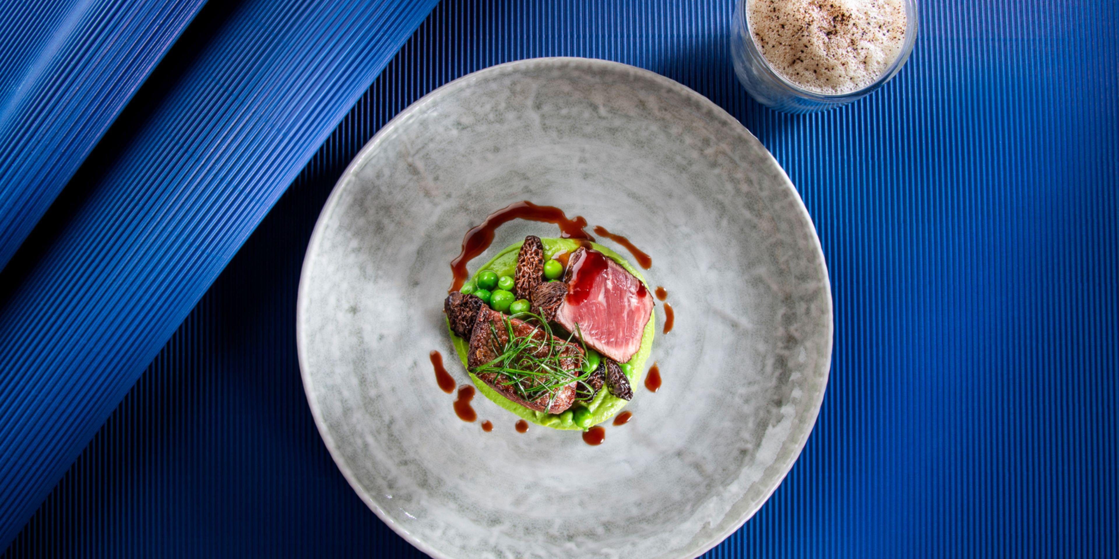 Savour diverse dining delights at our exquisite restaurants. Enjoy all-day dining and a lavish Sunday brunch at Woods prepared with fresh, local produce. Experience the intimacy of Les Nations Bar & Lounge, serving Mediterranean cuisine and classic cocktails. We offer culinary excellence to enhance your stay in Geneva.