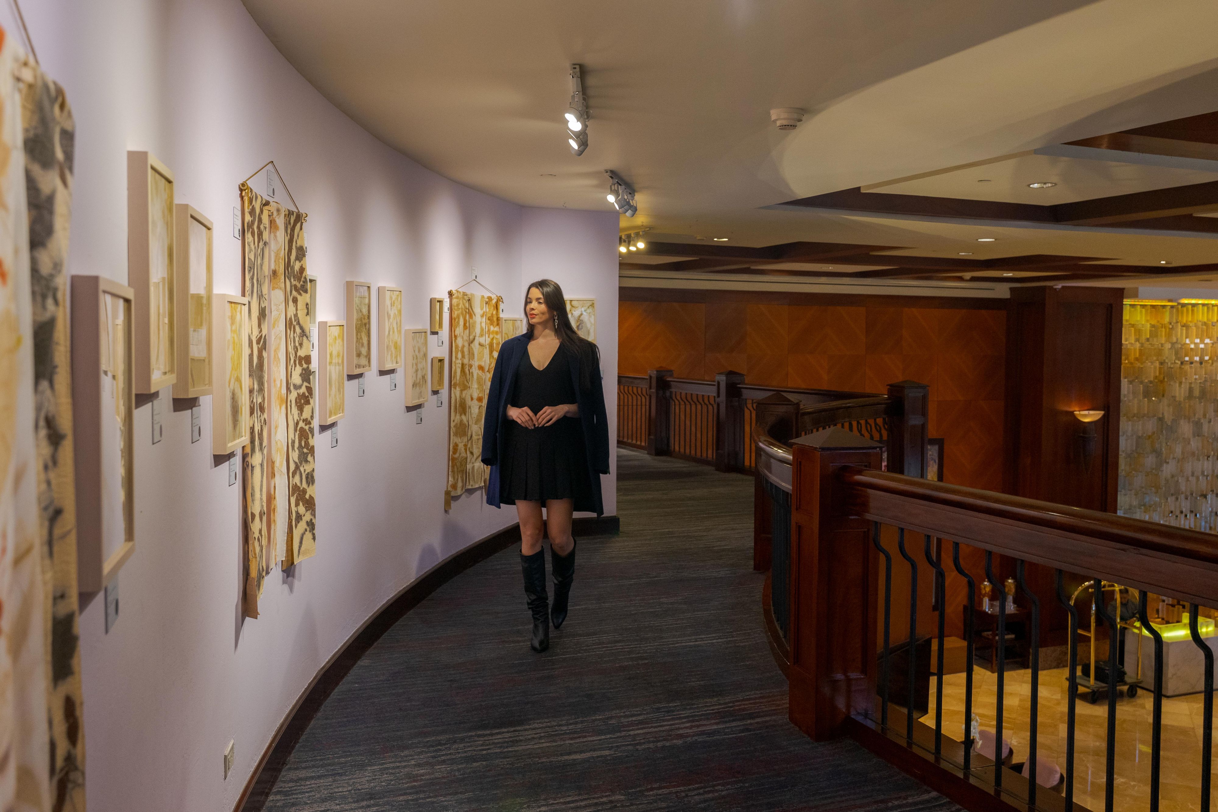 Woman enjoying lobby hall artwork at InterContinental The Real Guatemala