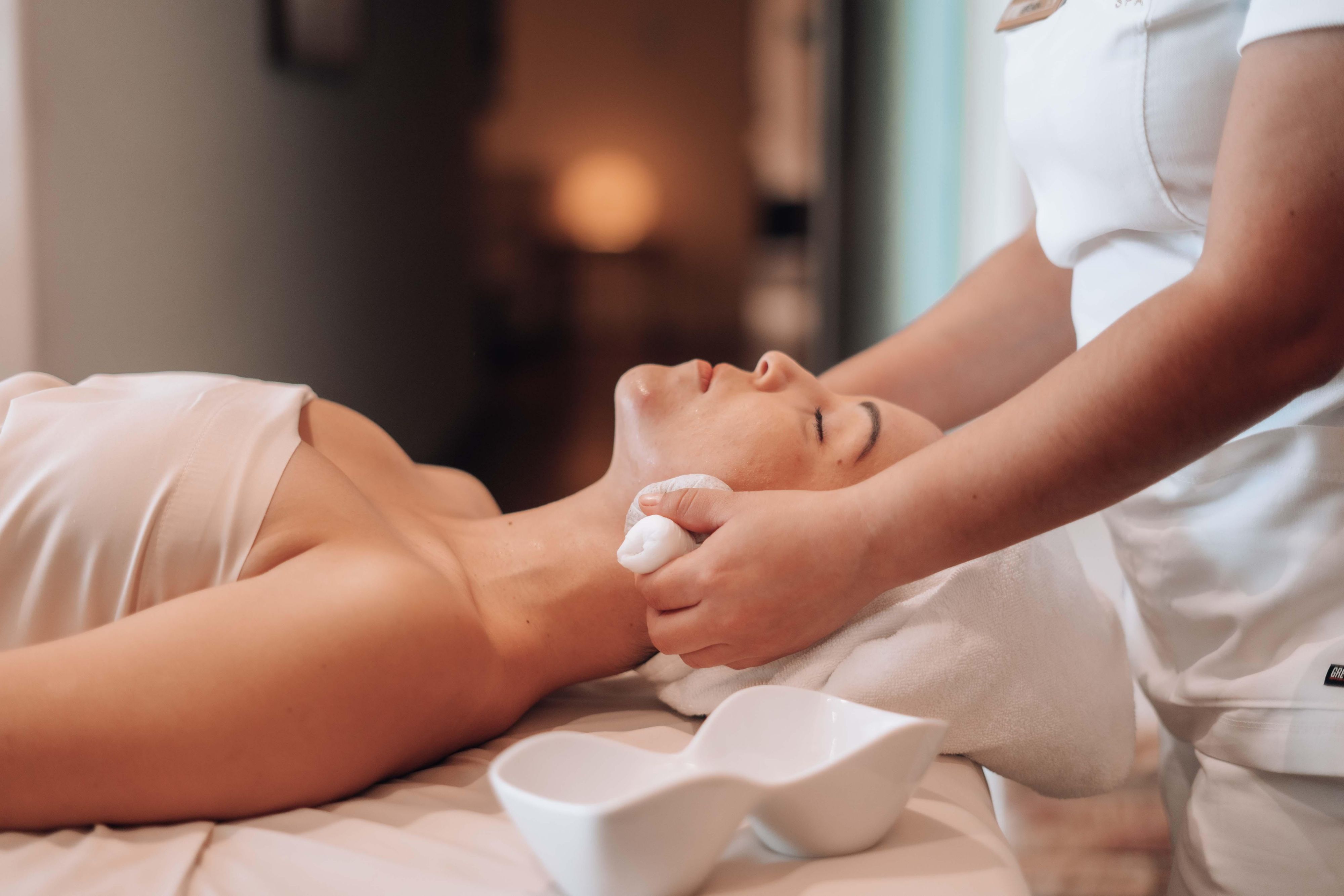 Woman at a spa enjoying a relaxing massage