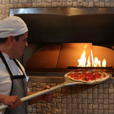 Enjoy the unique taste of wood-fired pizza