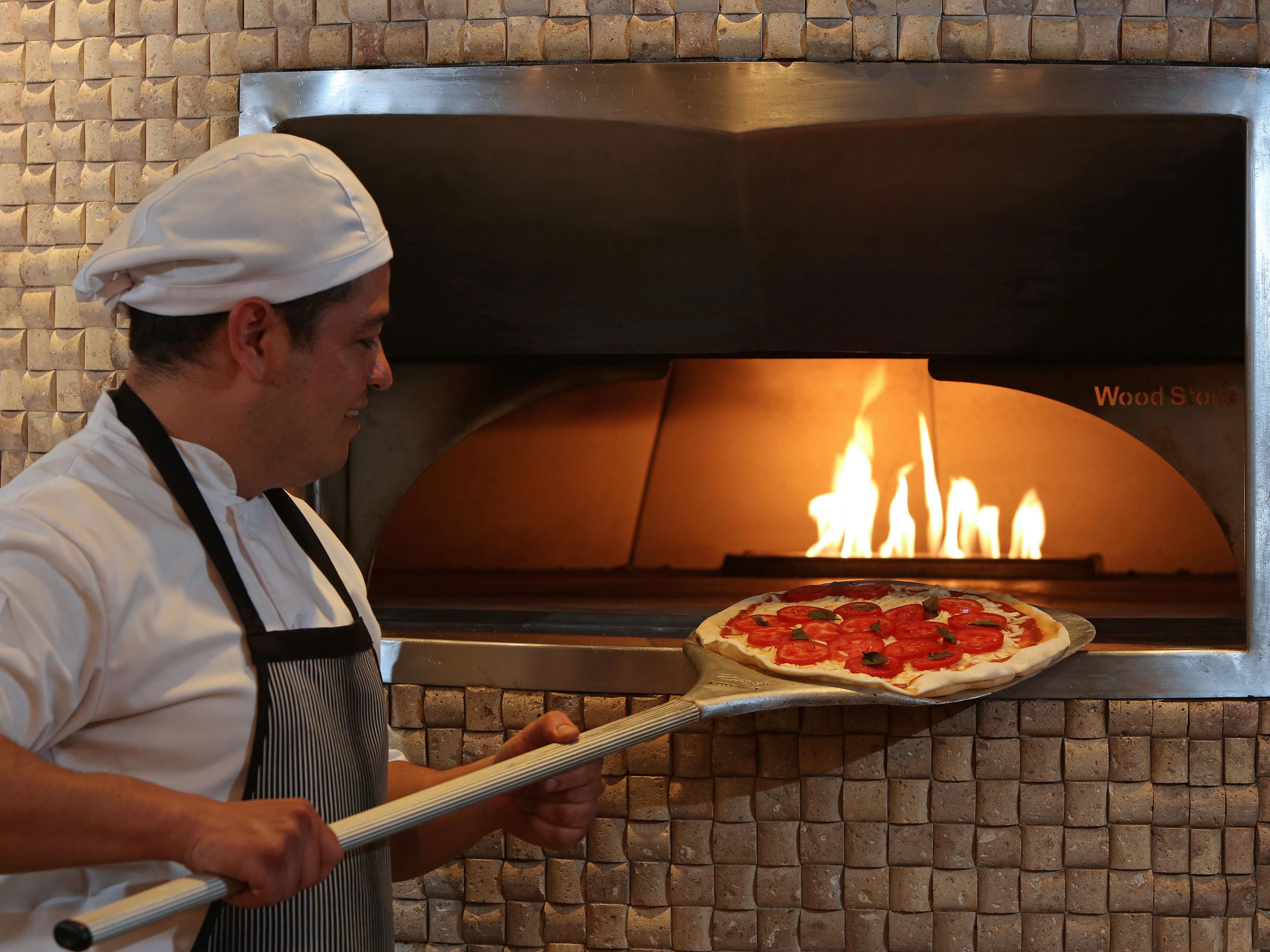 Enjoy the unique taste of wood-fired pizza