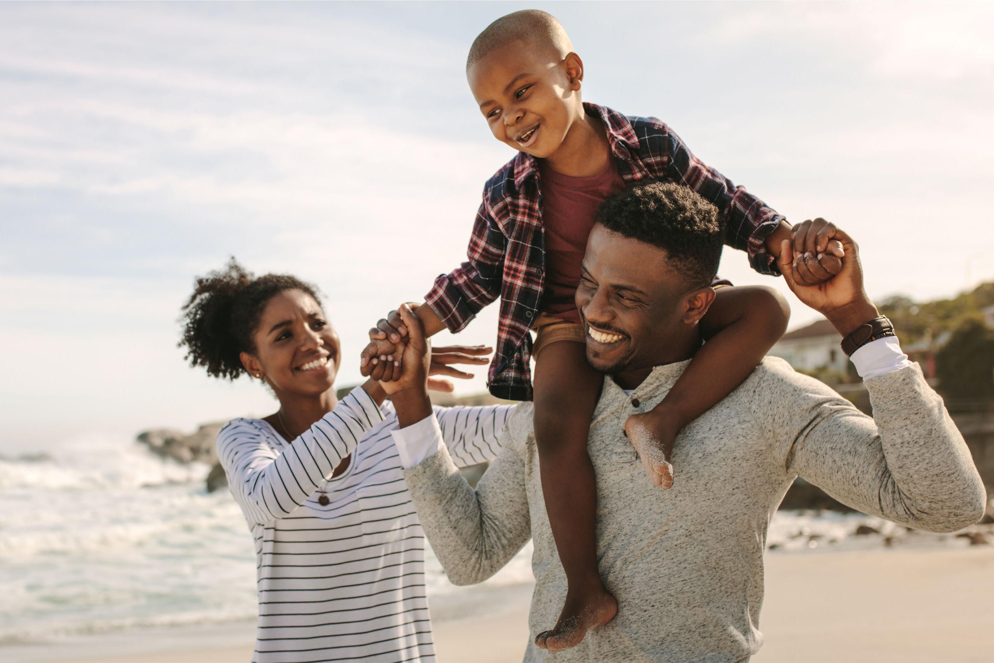 A family of three smiling