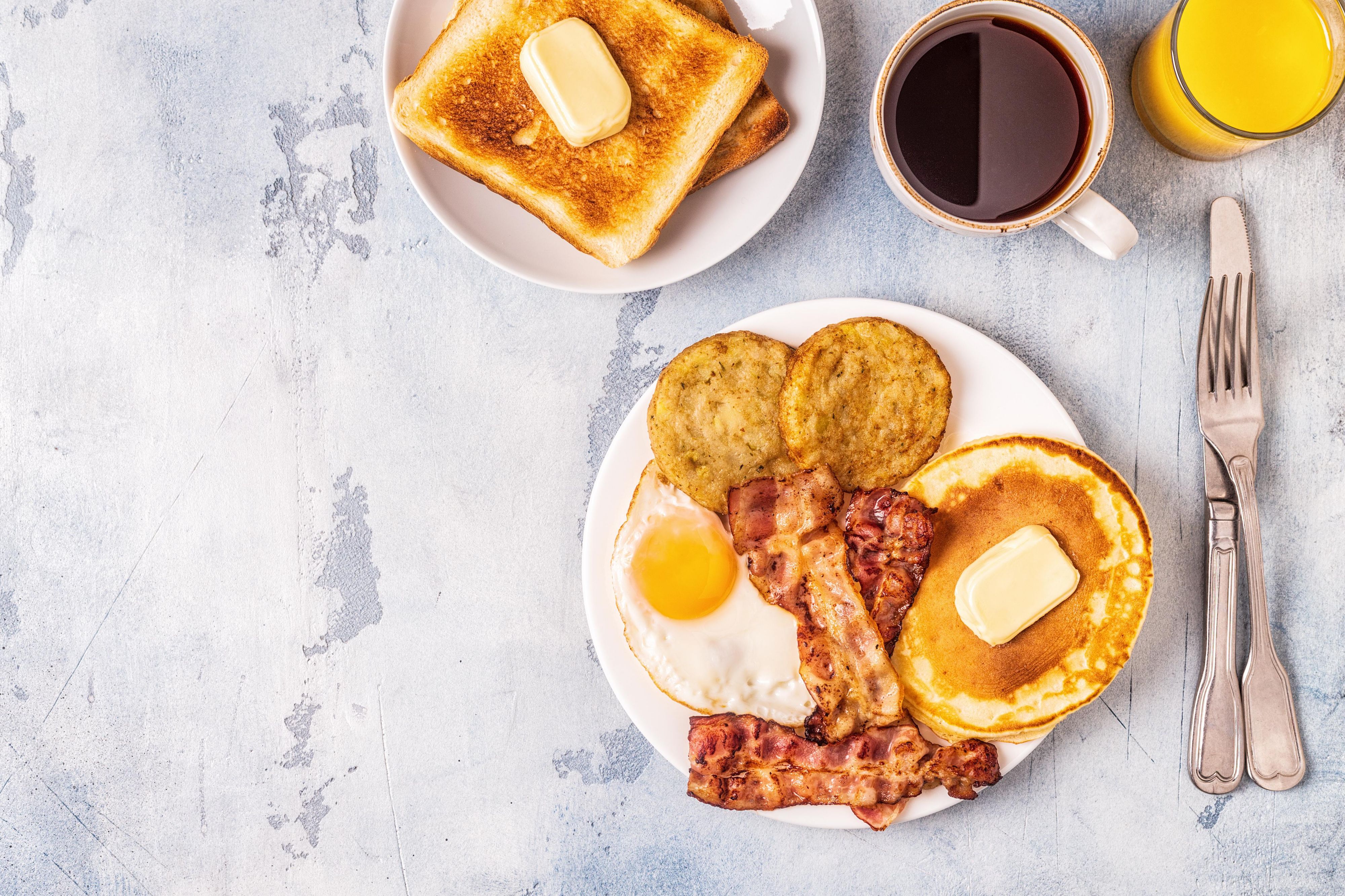 Breakfast plate featuring eggs and pancakes