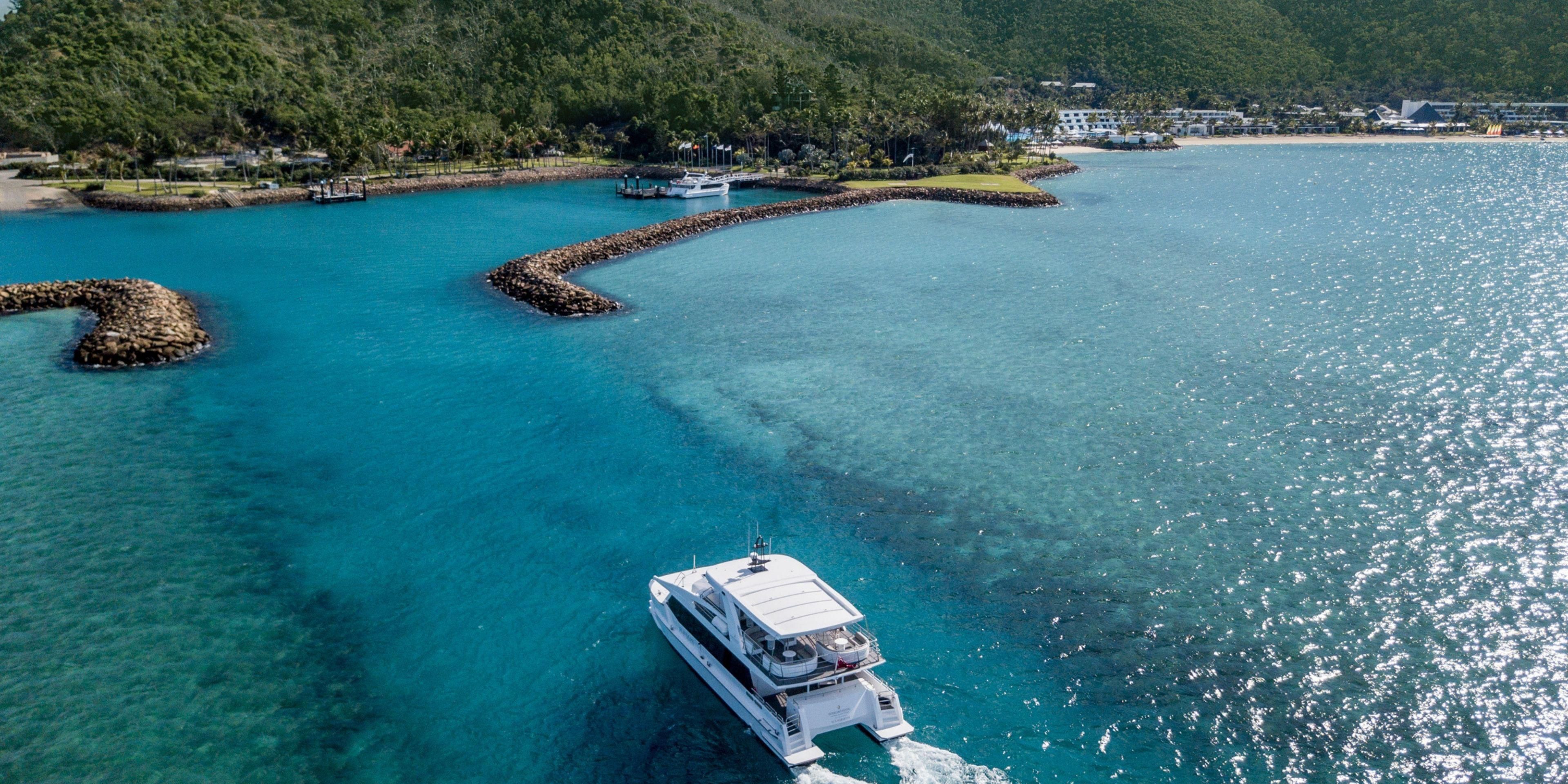 Travel to Hayman Island in style as you enjoy a one hour scenic luxury launch journey through the Whitsundays. Book your 60-minute transfer direct to the resort from/to Hamilton Island airport or Coral Seas Marina through hayman.reservations@ihg.com. Or elevate your arrival to new heights with a 15-min private helicopter ride to the island. 