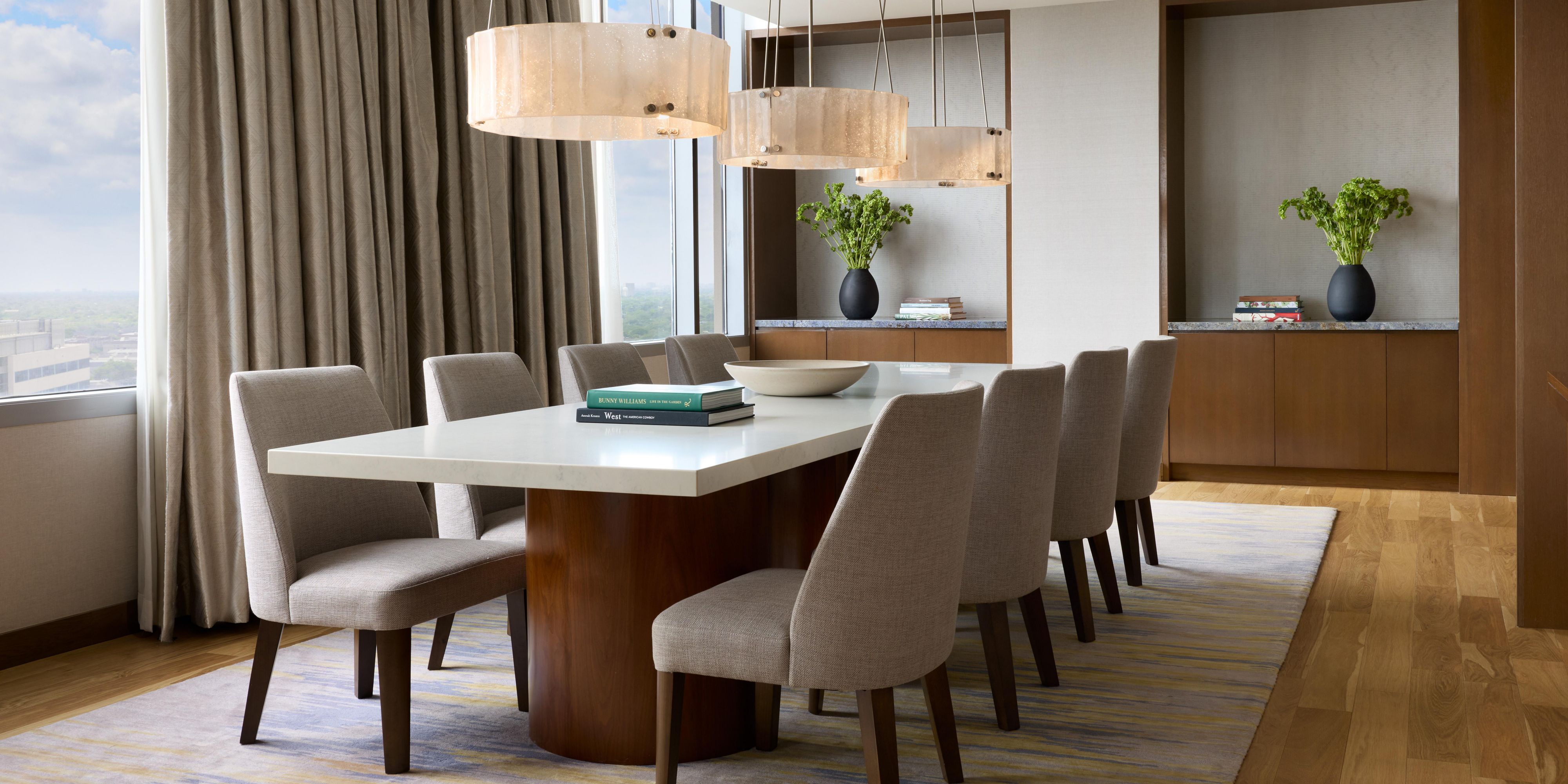 Private dining room with long table and modern chairs. 