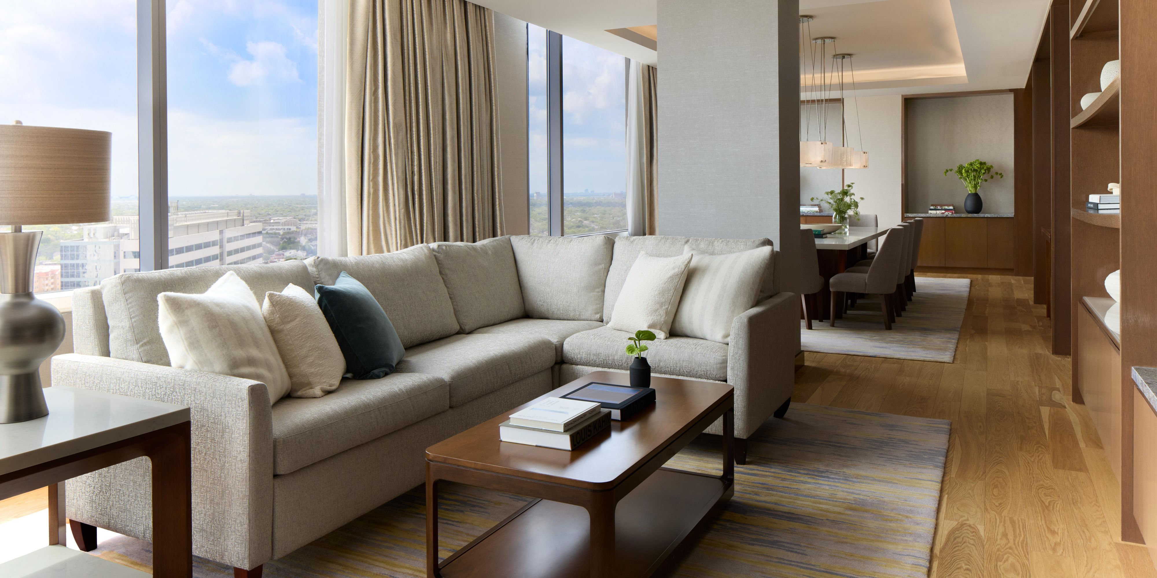 Suite living area with sofa and TV stand.