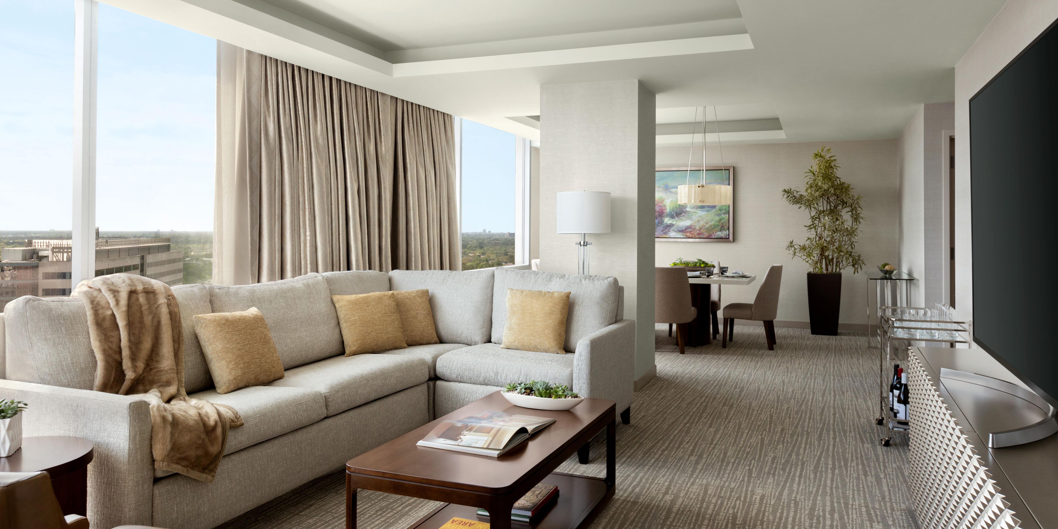 The Grand Suite includes separate dining and living areas.