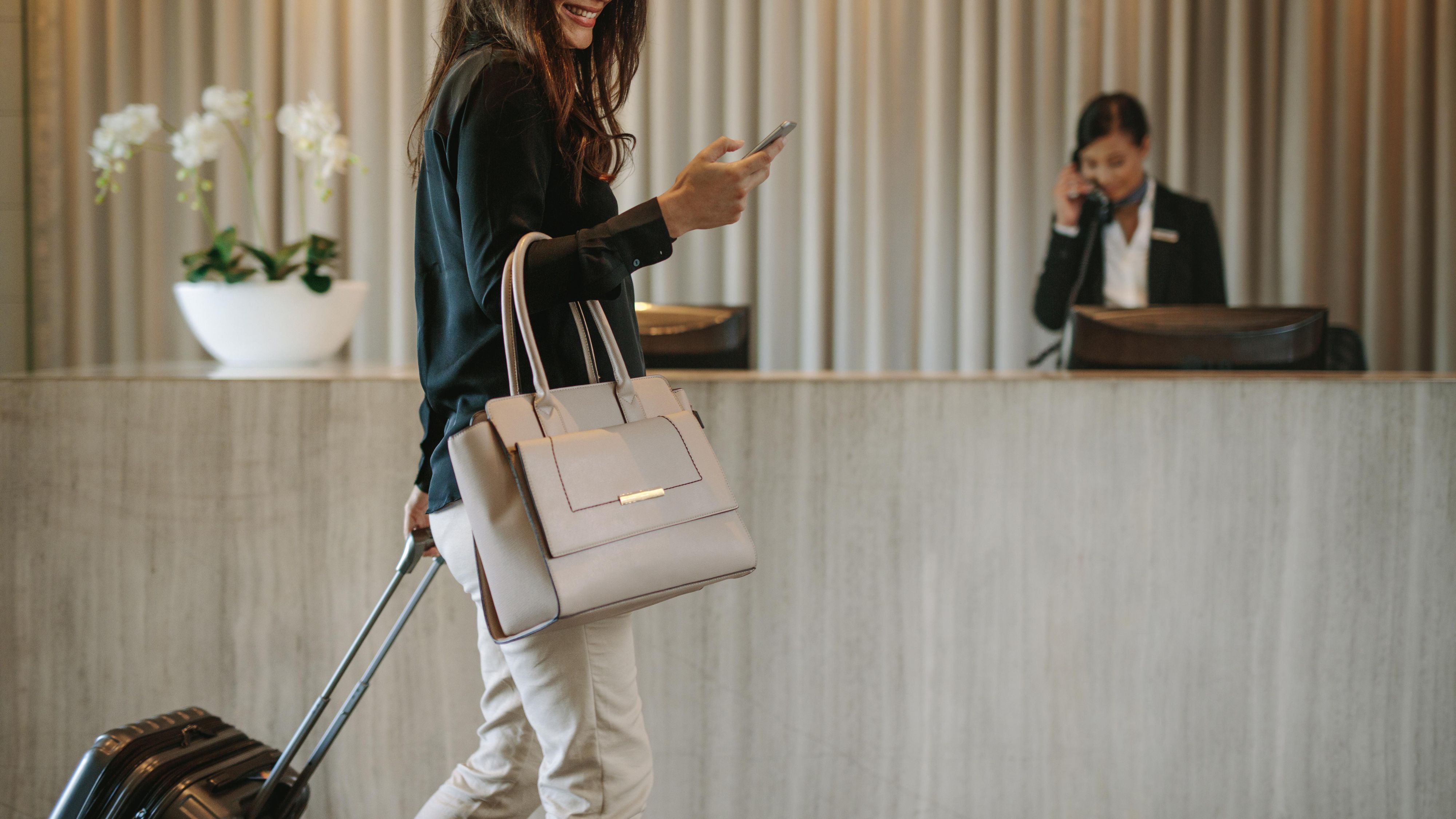 business woman checking into hotel