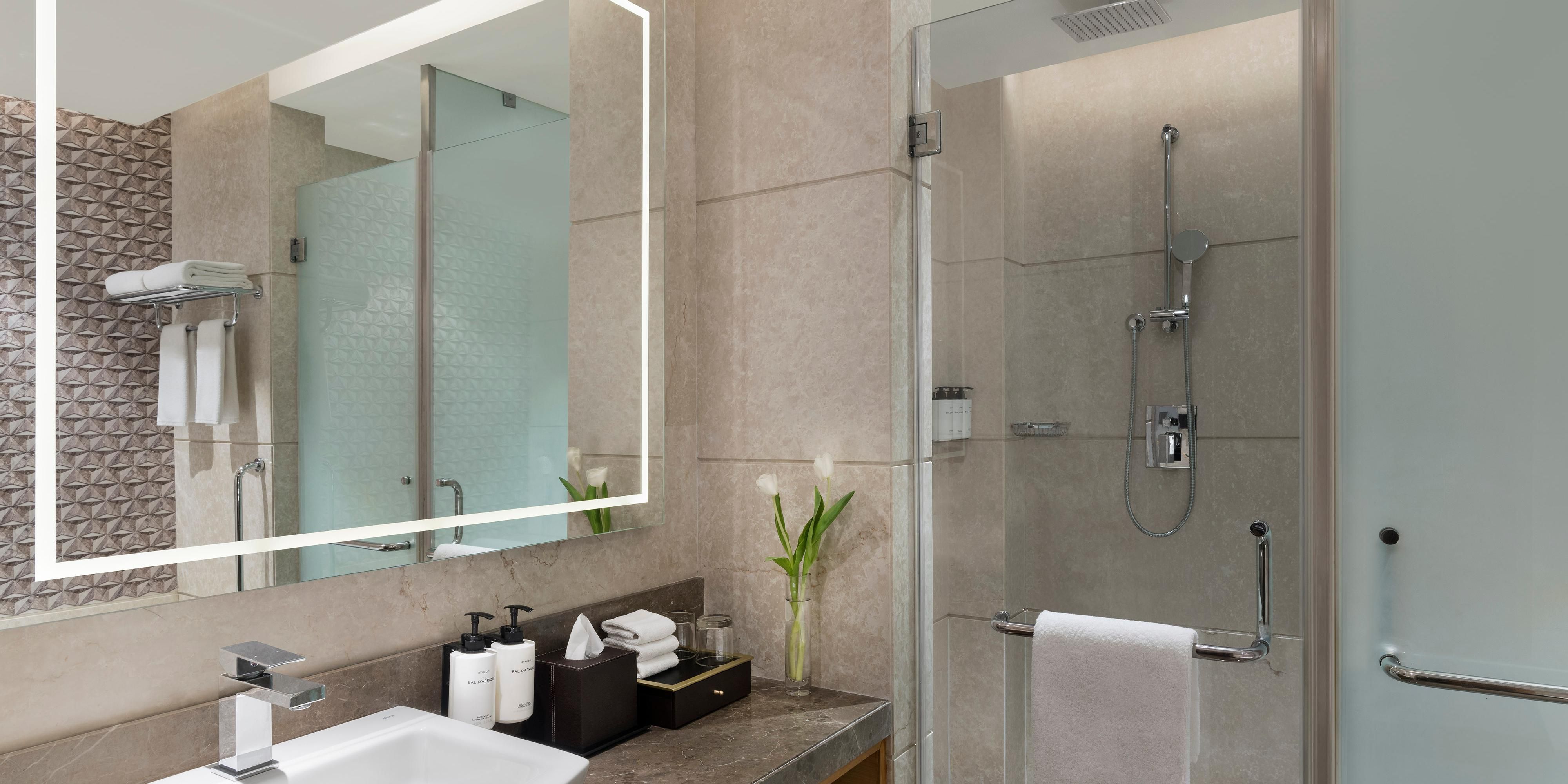 Spacious bathroom with premium Byredo toiletries & a bathtub