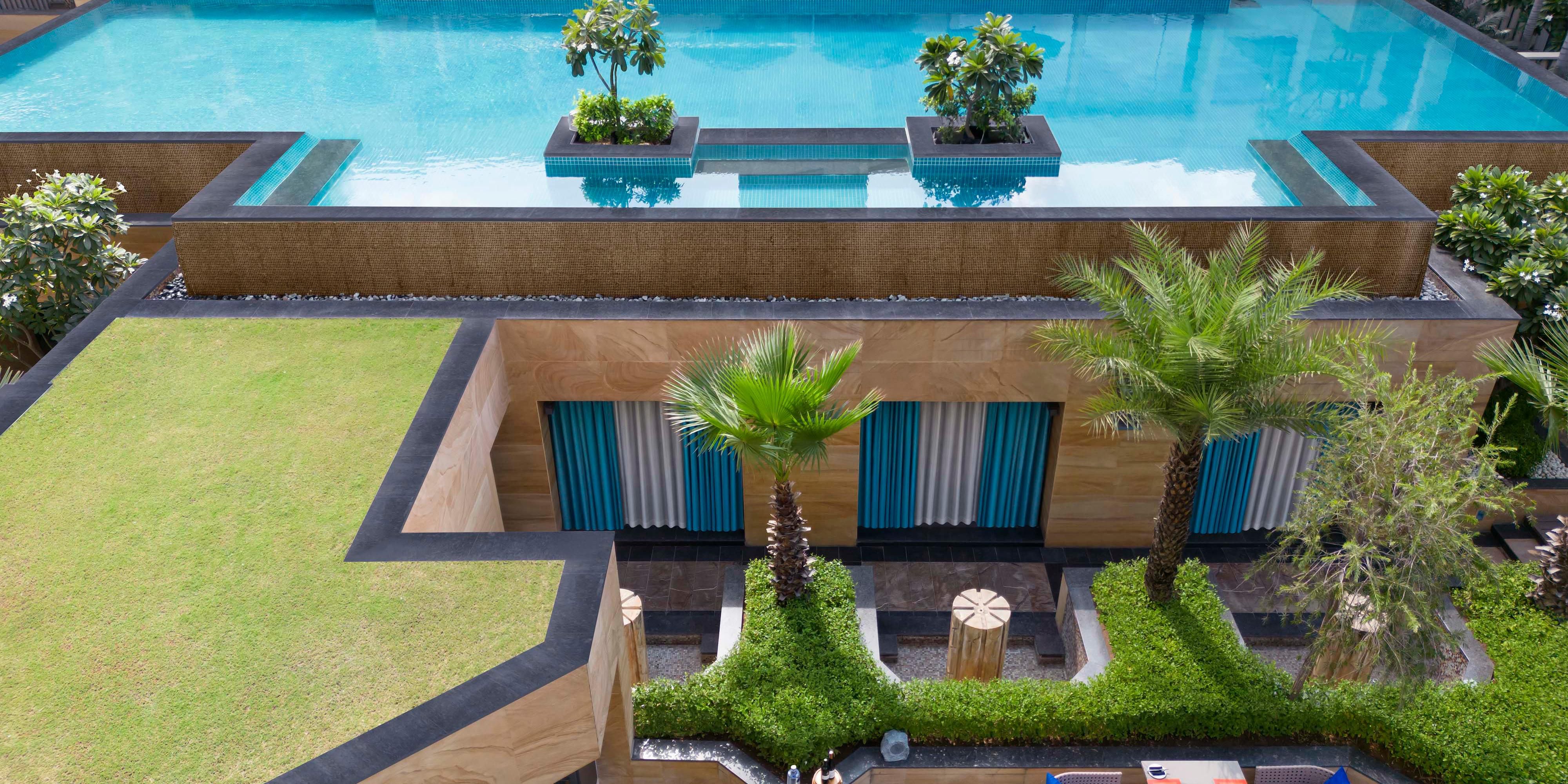 Swim, unwind, and savor downtime by the outdoor swimming pool