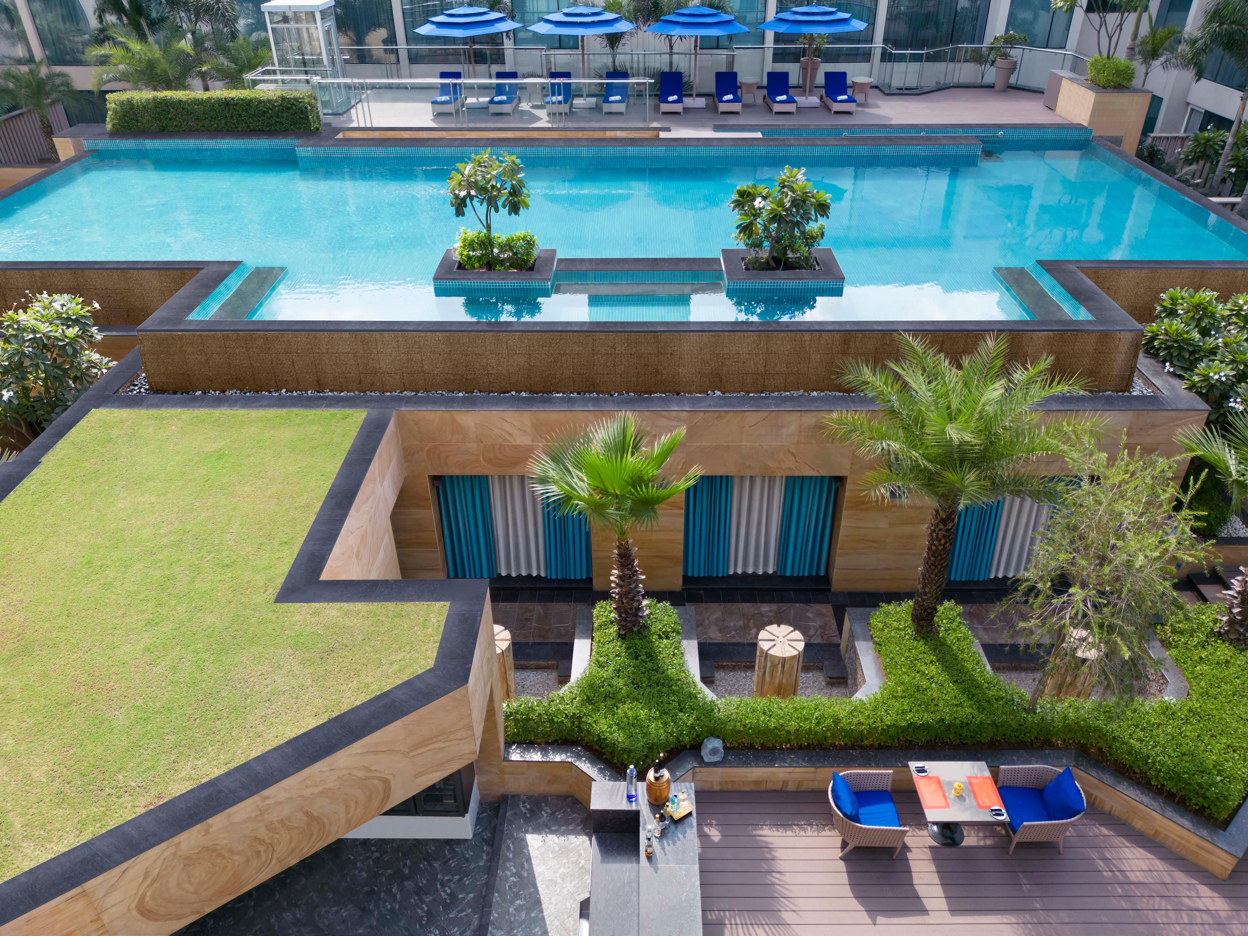 Swim, unwind, and savor downtime by the outdoor swimming pool