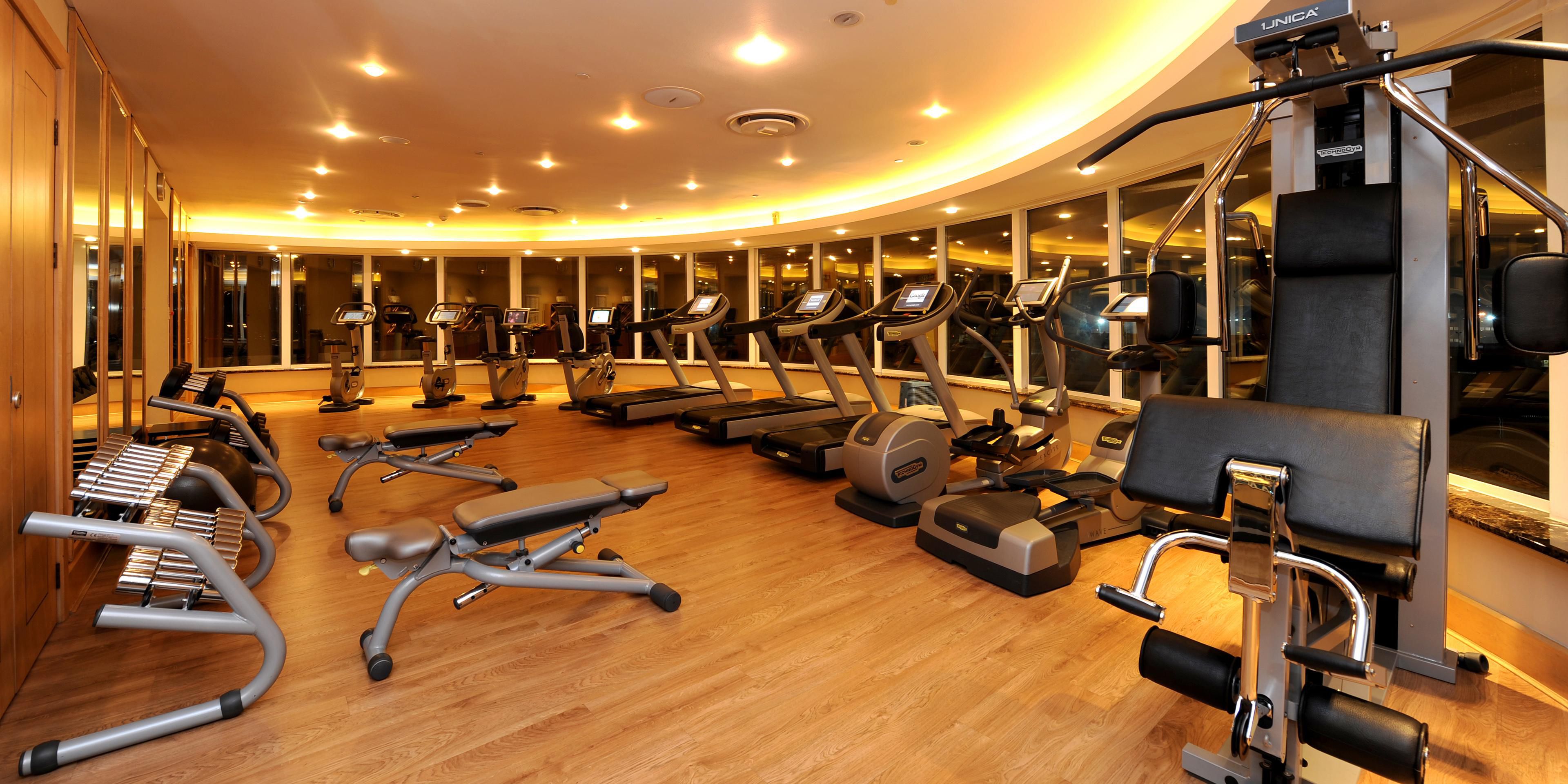 Don't miss a workout at our fitness center, which includes modern Technogym machines. The space is temperature controlled and features full length mirrors, chilled water, gym-towels, and large screen TVs. Located on the top floor of the hotel next to the spa and heated pool, the gym is the perfect place to work out before or after a flight.