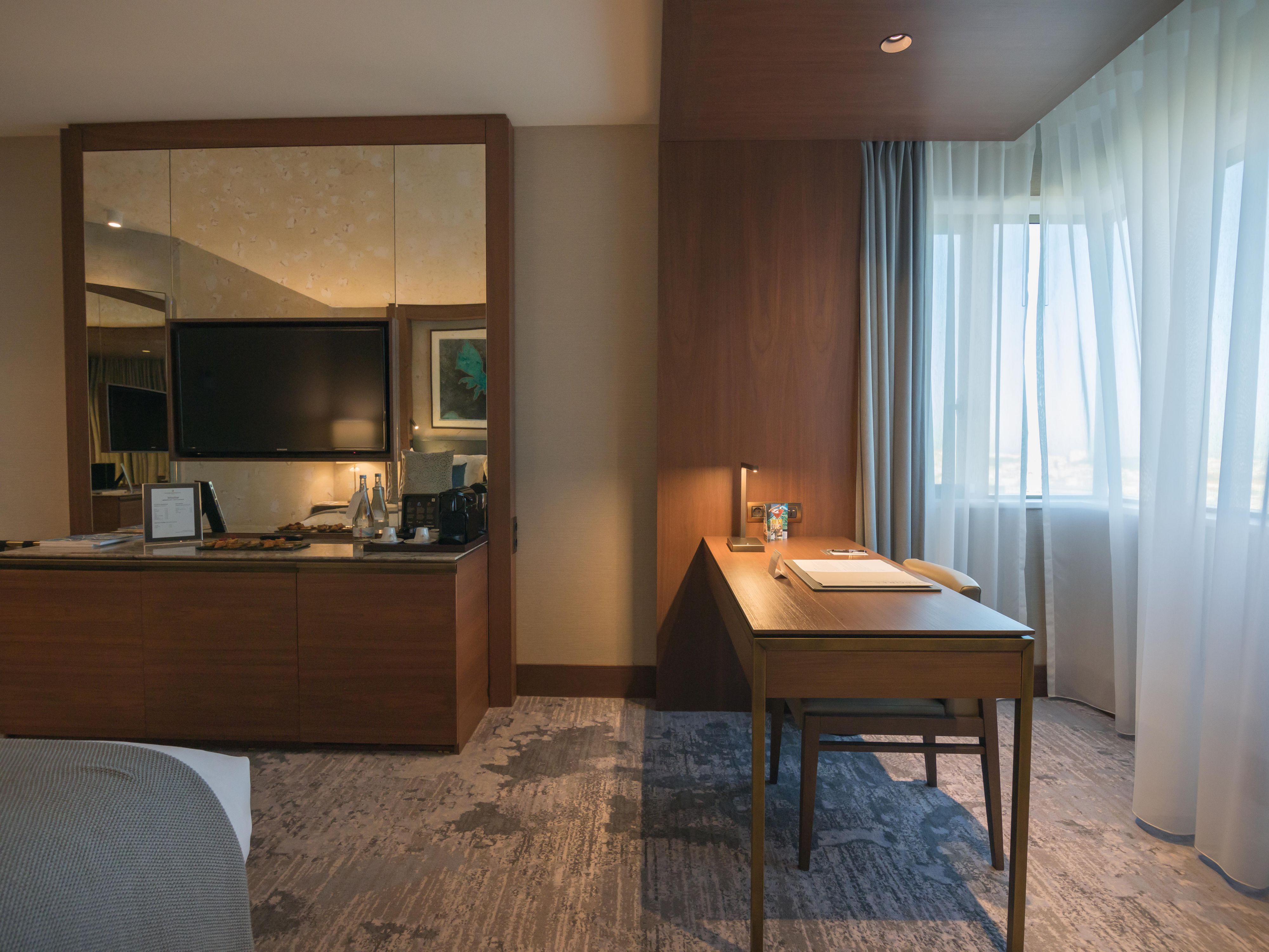 Our contemporary room is furnished with a large working desk