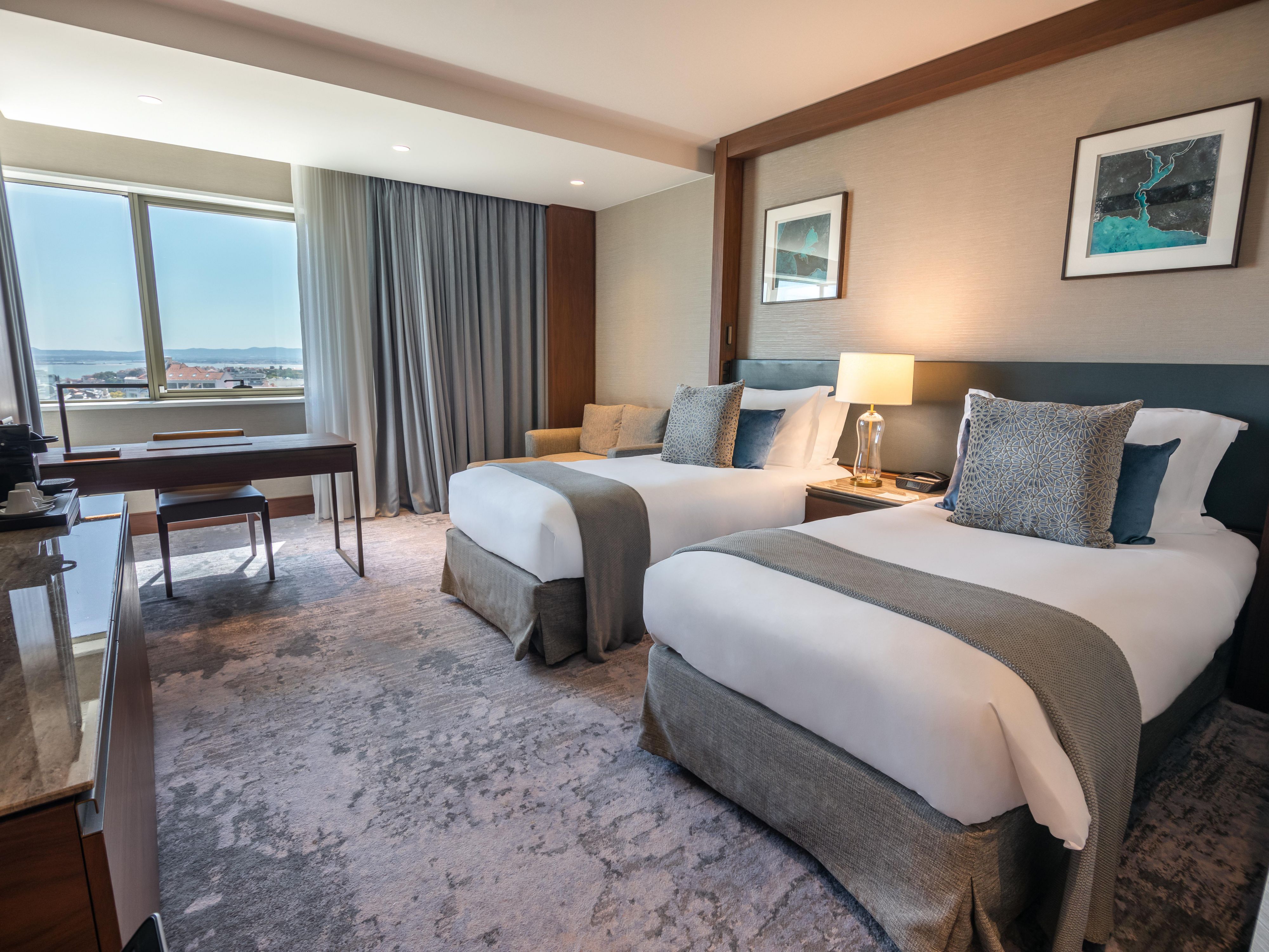 Our twin bedroom with River View is the perfect getaway in Lisbon