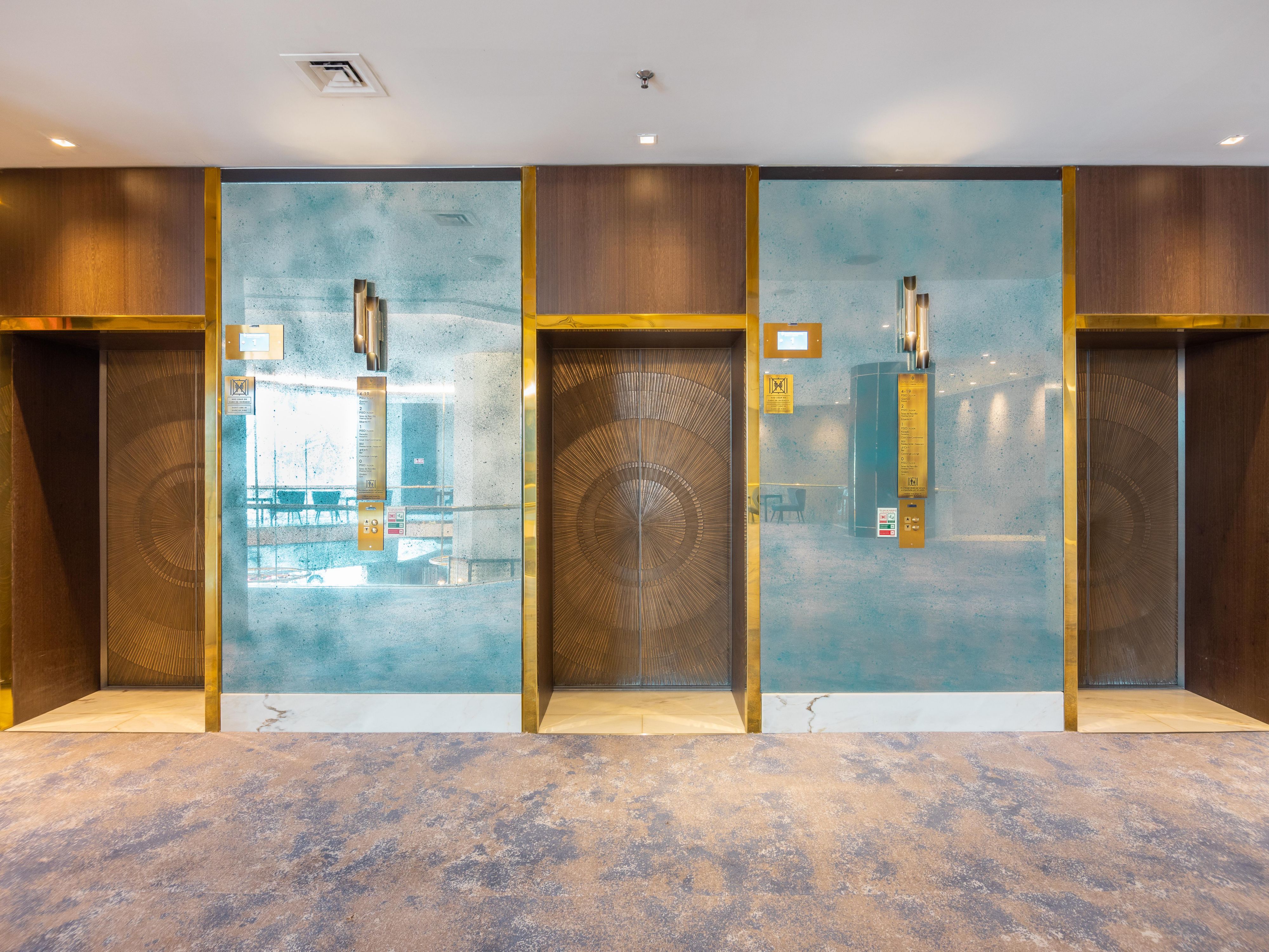 There are 3 elevators at your service in the lobby!