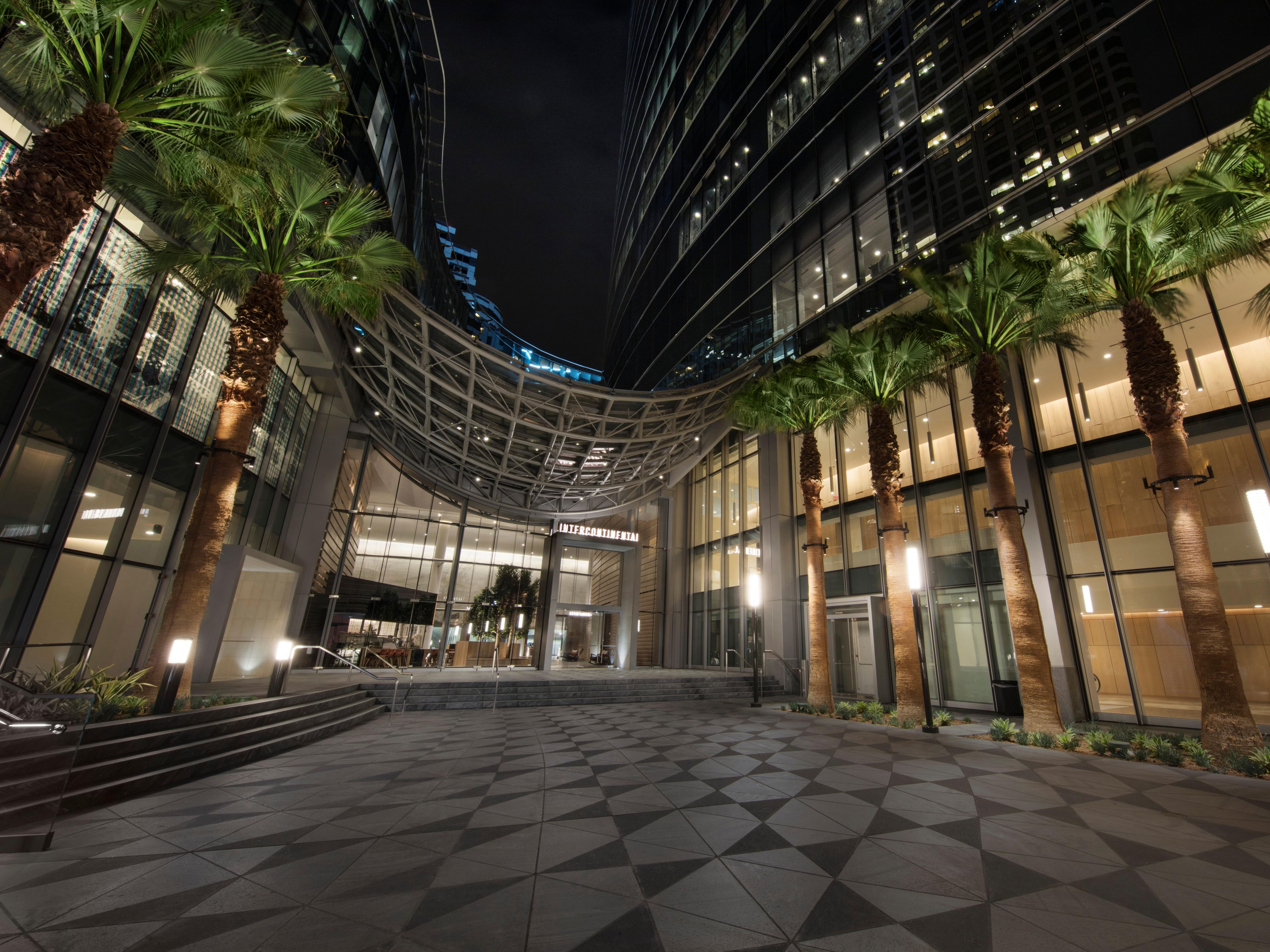 Palm tree lined entrance of InterContinental LA Downtown hotel