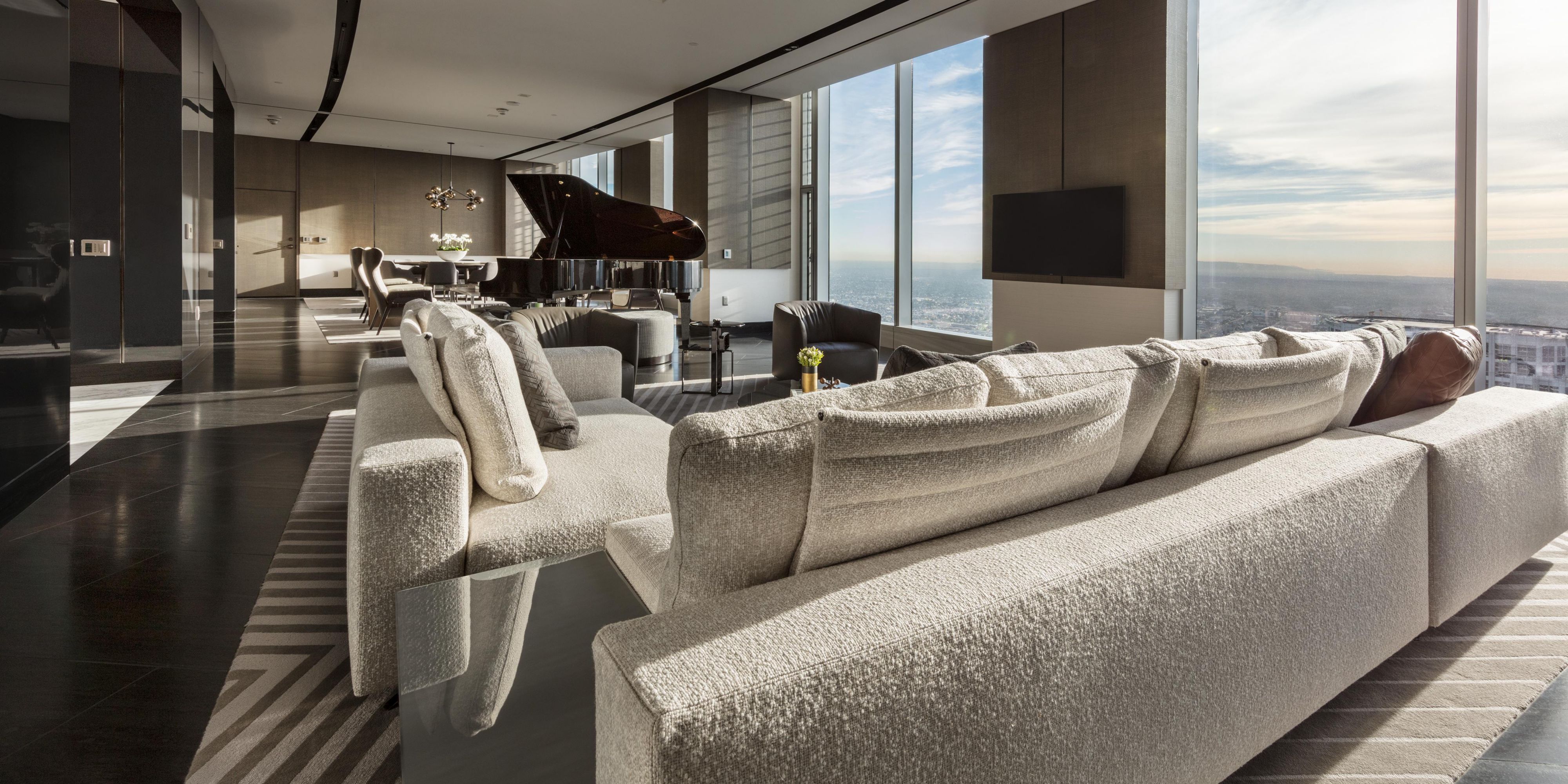 Living area with grand piano in the Presidential Suite