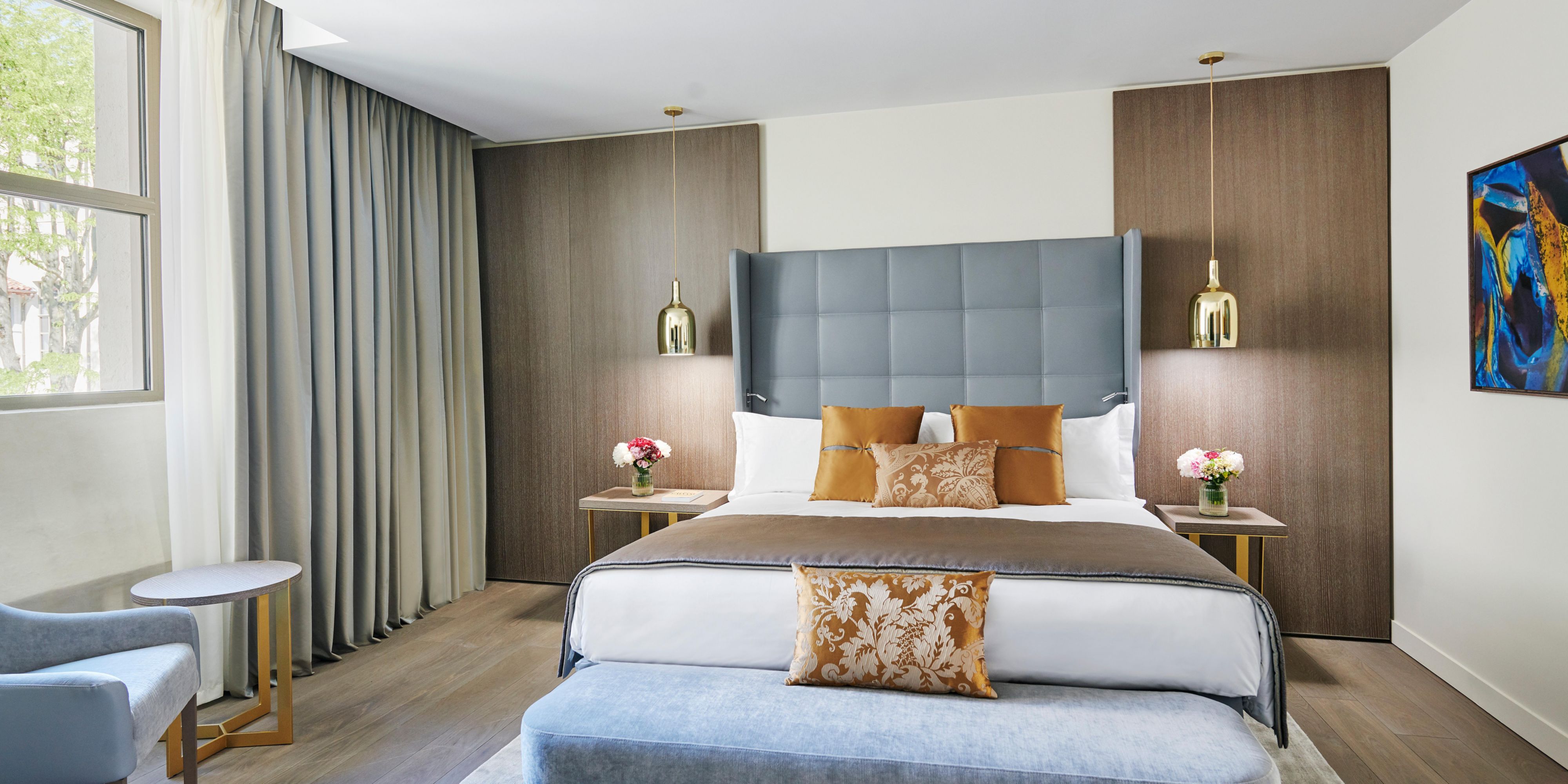 Prestige Suite | Bedroom overlooking a courtyard garden