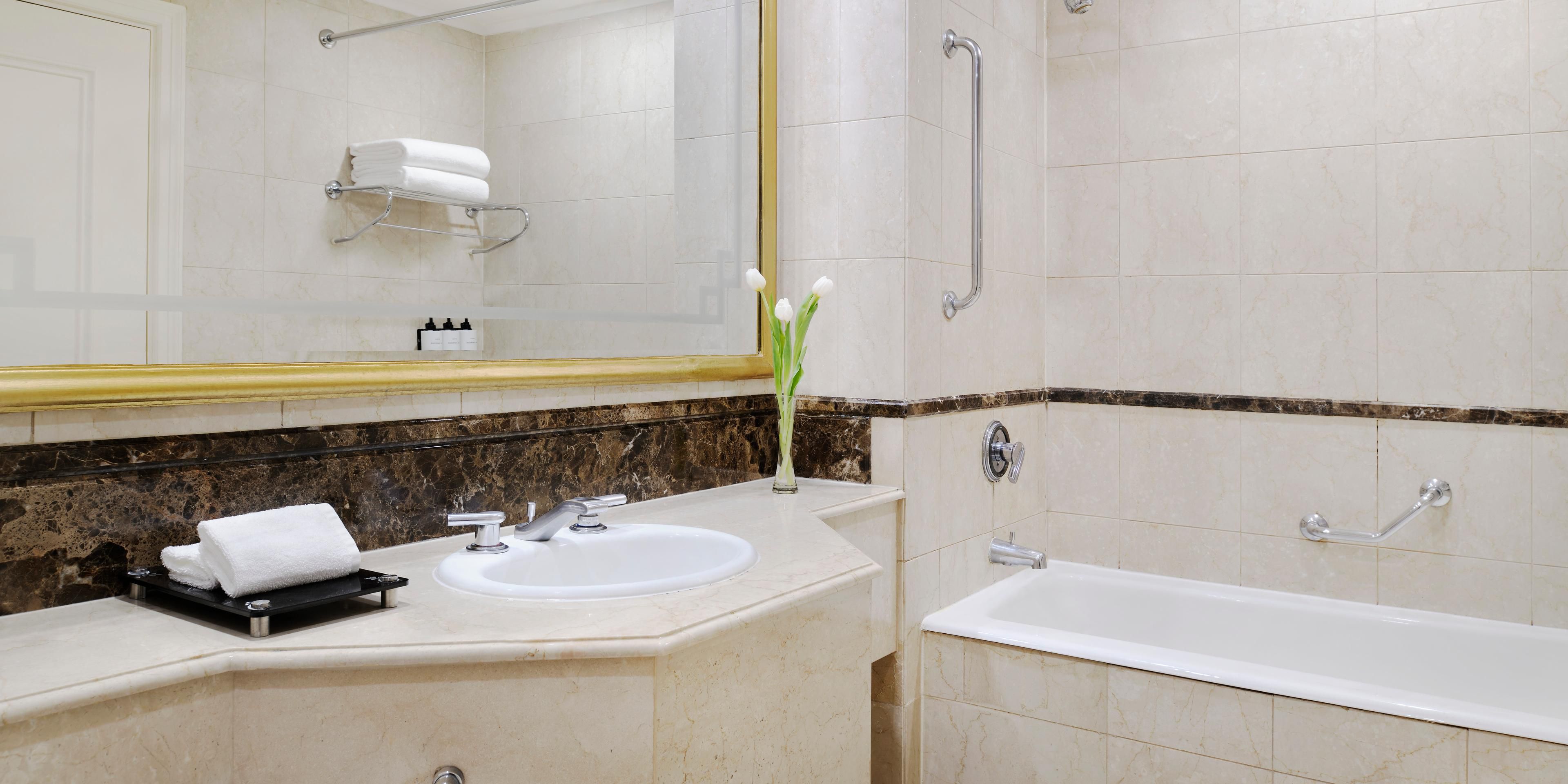 Enjoy bath experiences in a lavish marble bathroom