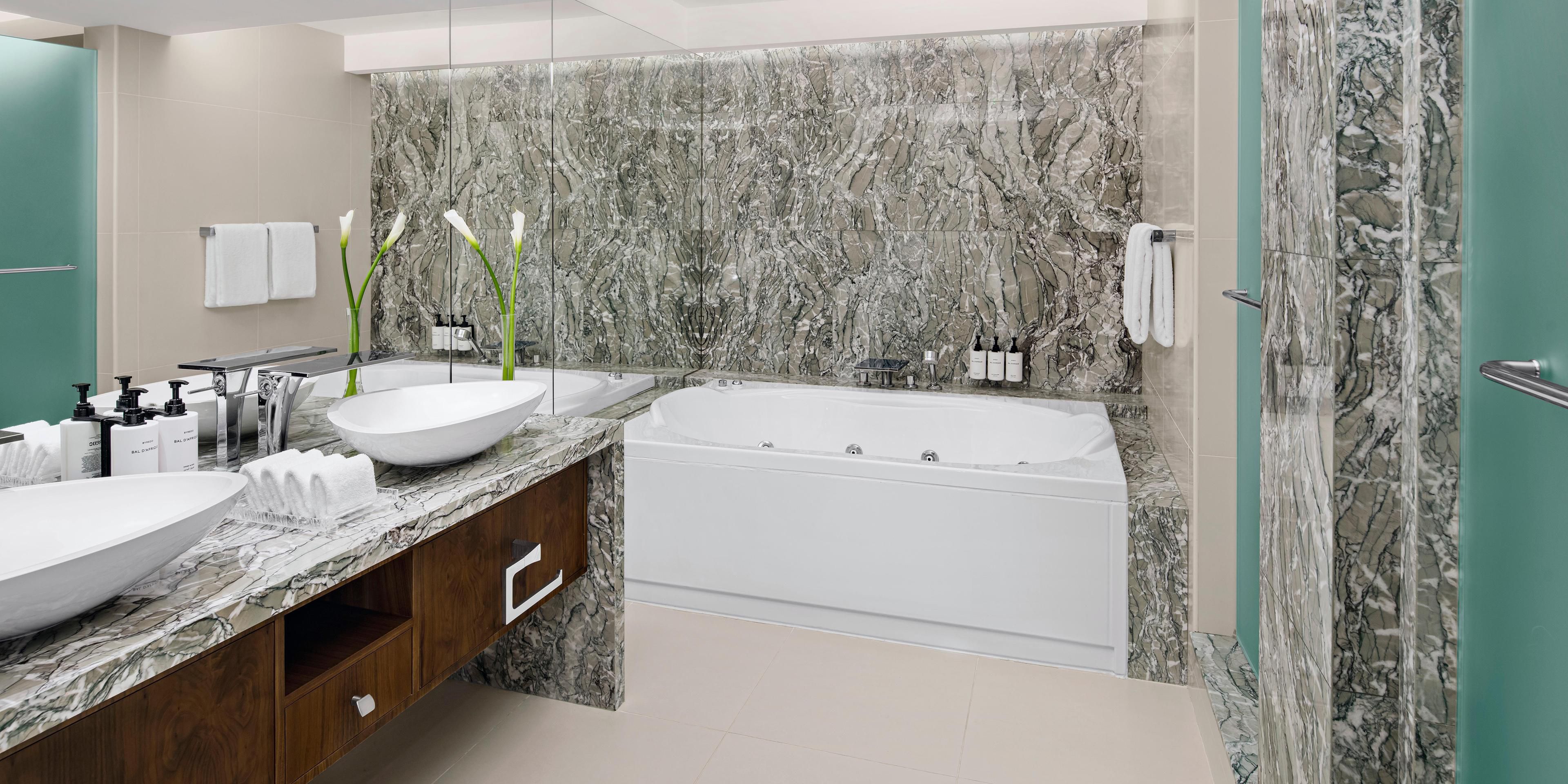 Suite bathroom with walk-in shower & bathtub